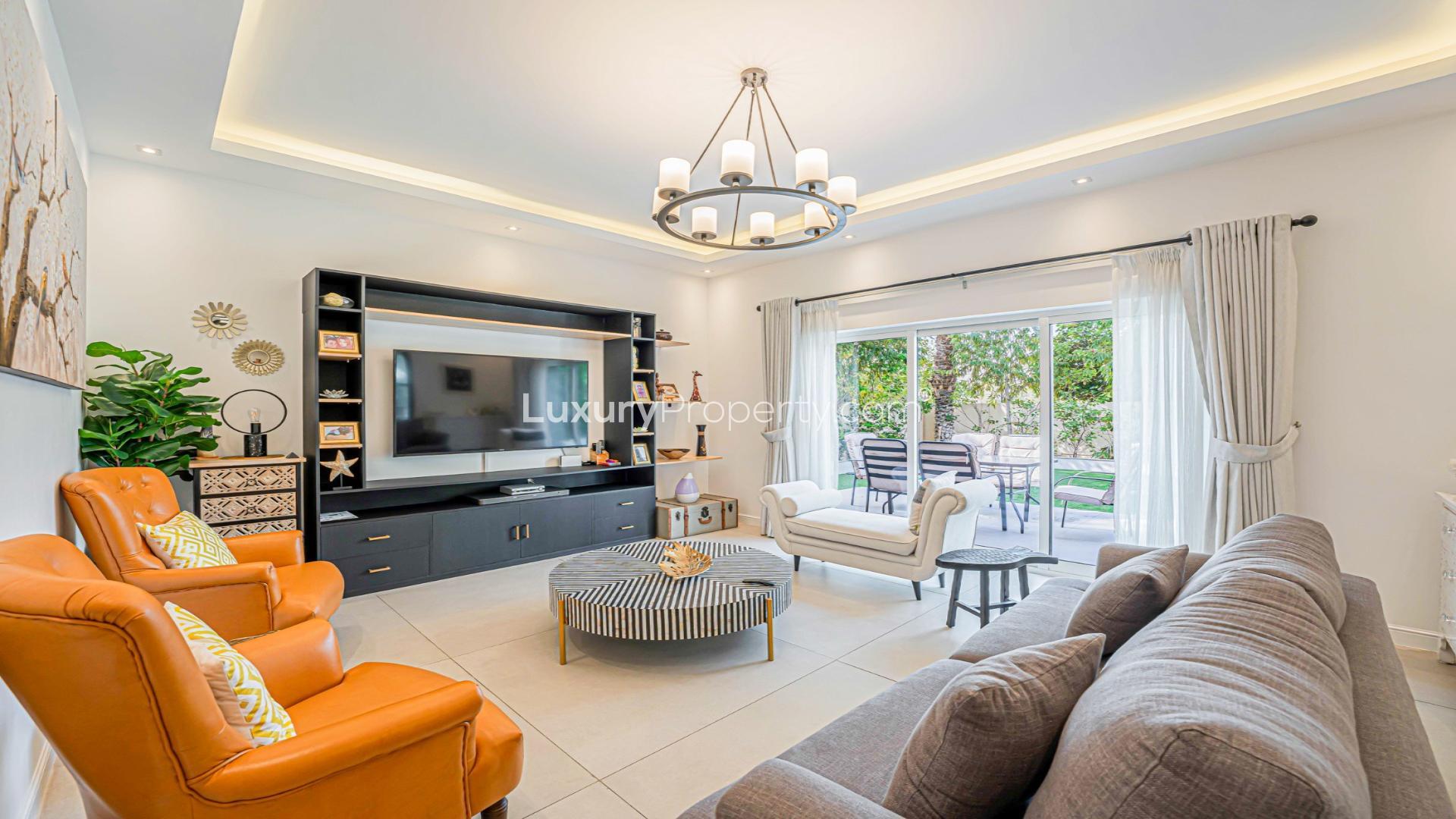 Luxurious living room in 4-bedroom Dubai Marina apartment, modern decor, spacious seating area