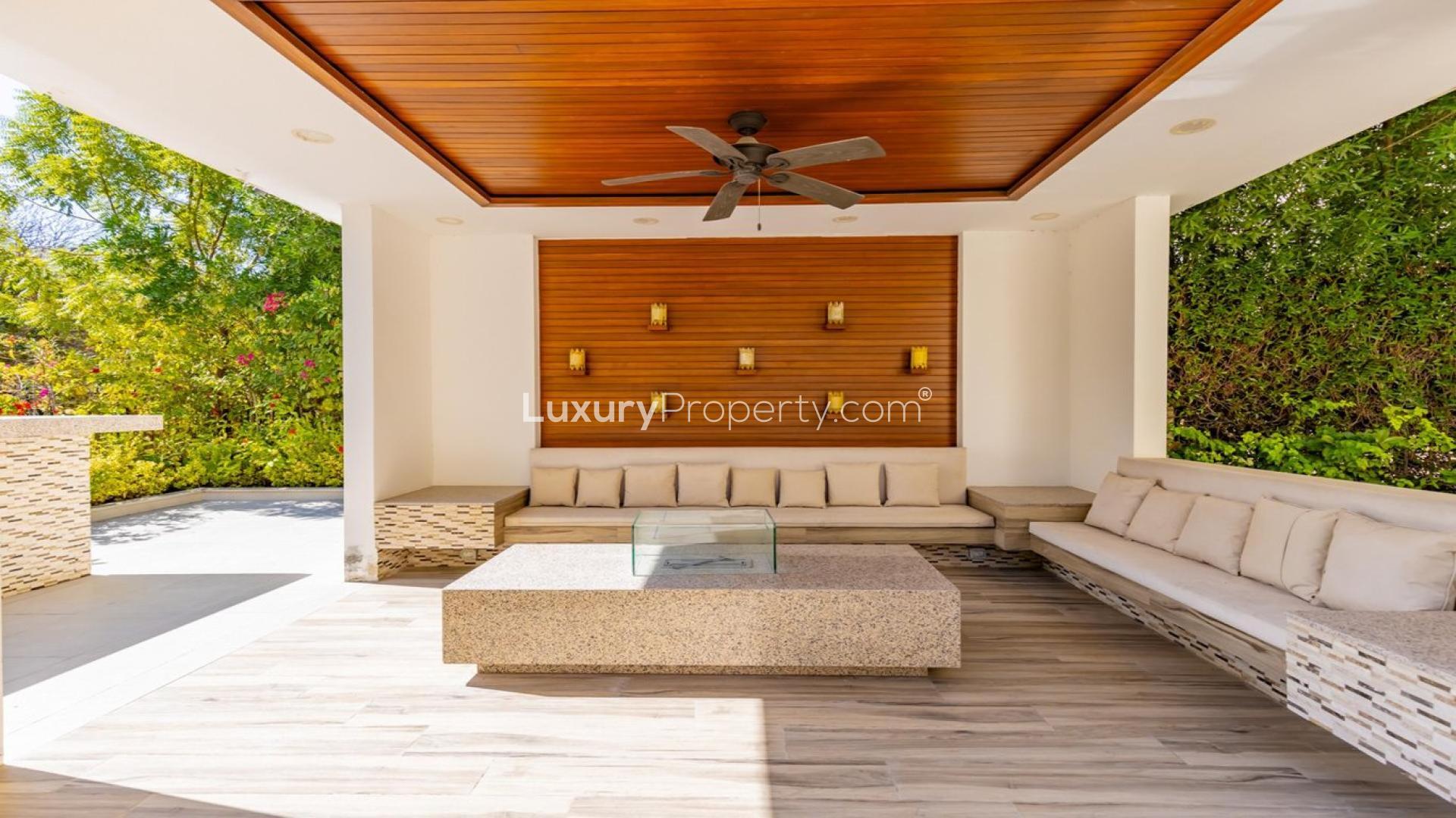 Luxurious villa in Jumeirah Islands with private pool and shaded seating area