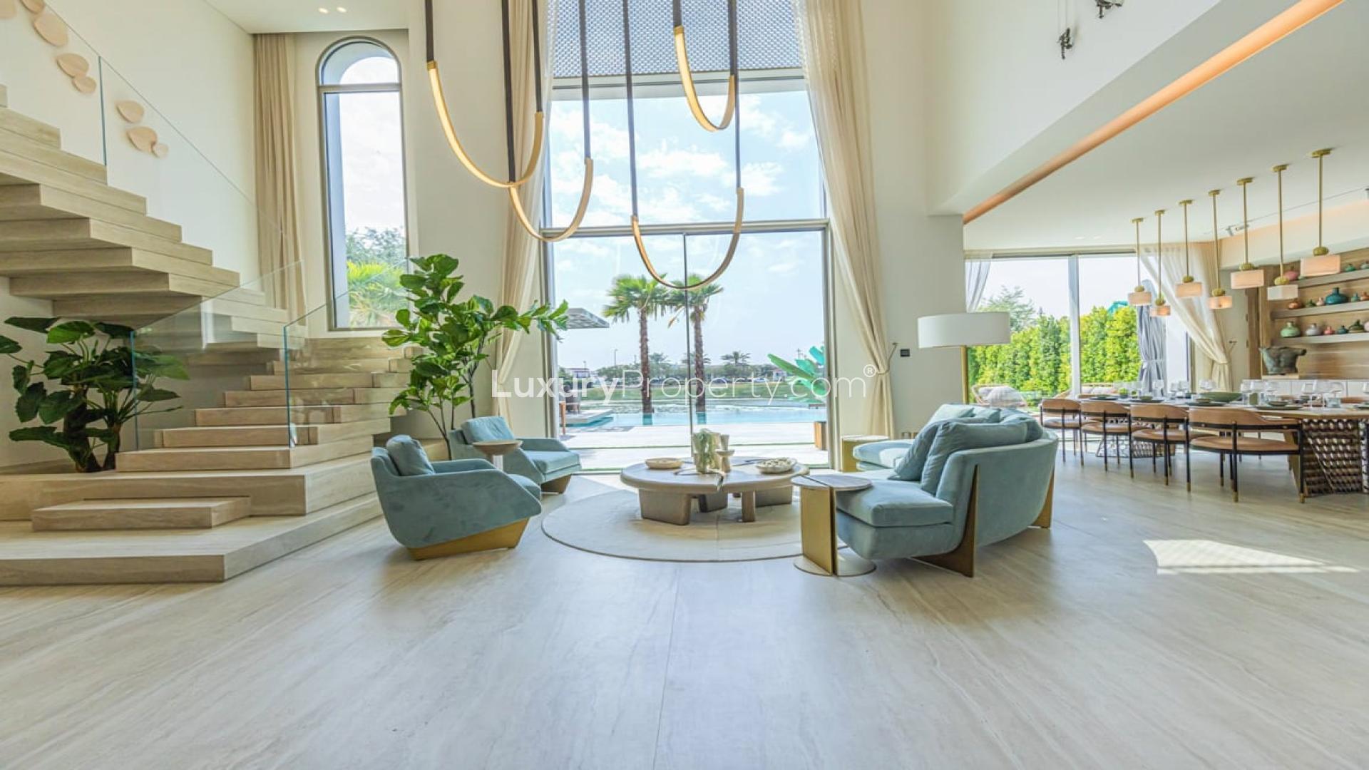 Luxurious open-plan living area in Jumeirah Islands villa, featuring modern decor and large windows