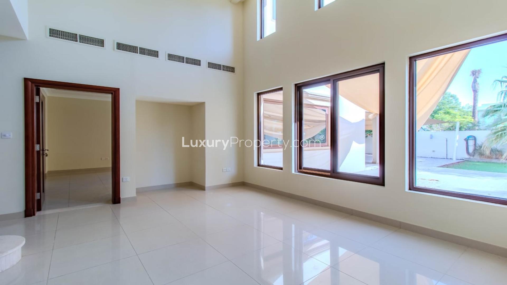 Luxurious villa exterior with lush garden in Rosa, Arabian Ranches 2 for sale