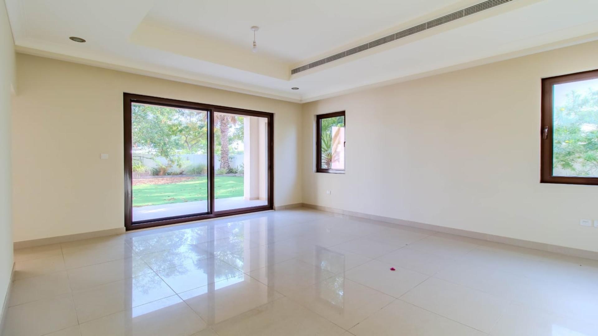 Luxurious 4-bedroom villa exterior with lush garden in Rosa, Arabian Ranches 2