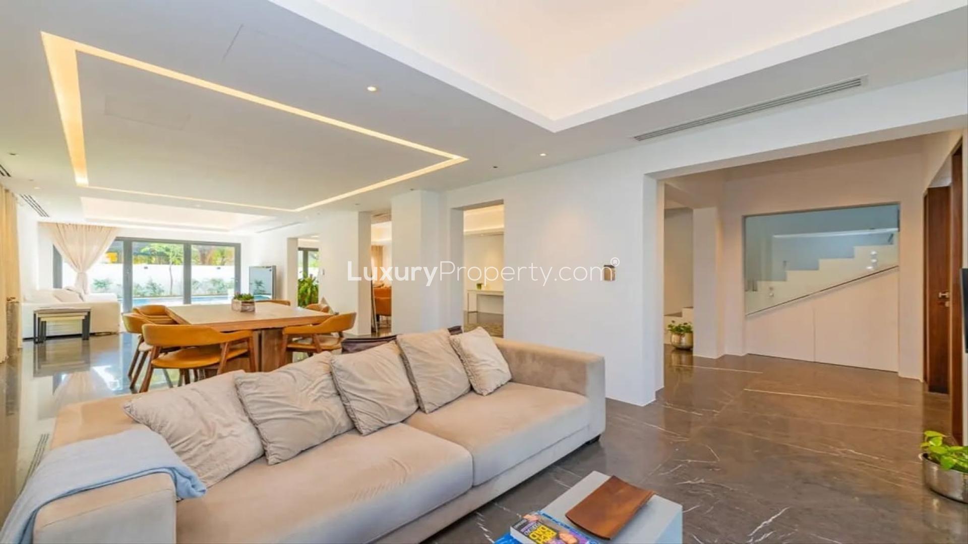 Luxurious living room in renovated Type 11 villa, Meadows 8, with modern decor and natural light