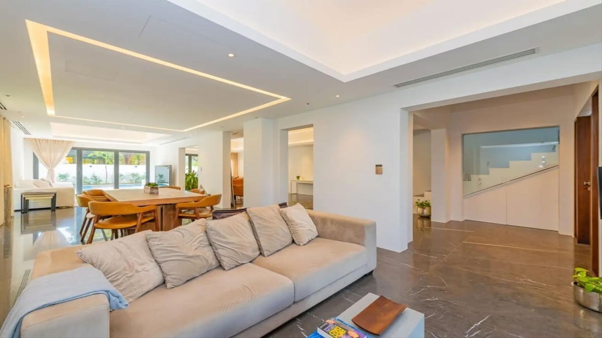 Luxurious living room in renovated Type 11 villa, Meadows 8, with modern decor and natural light