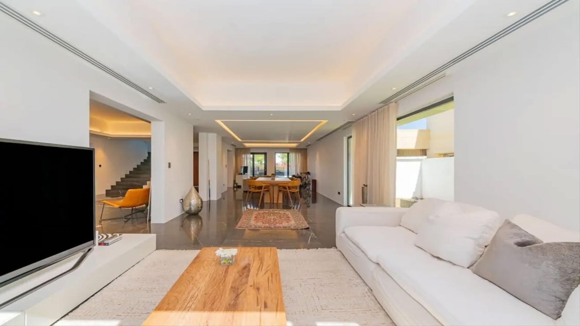 Luxurious Meadows 8 villa living room with pool view, spacious and modern design