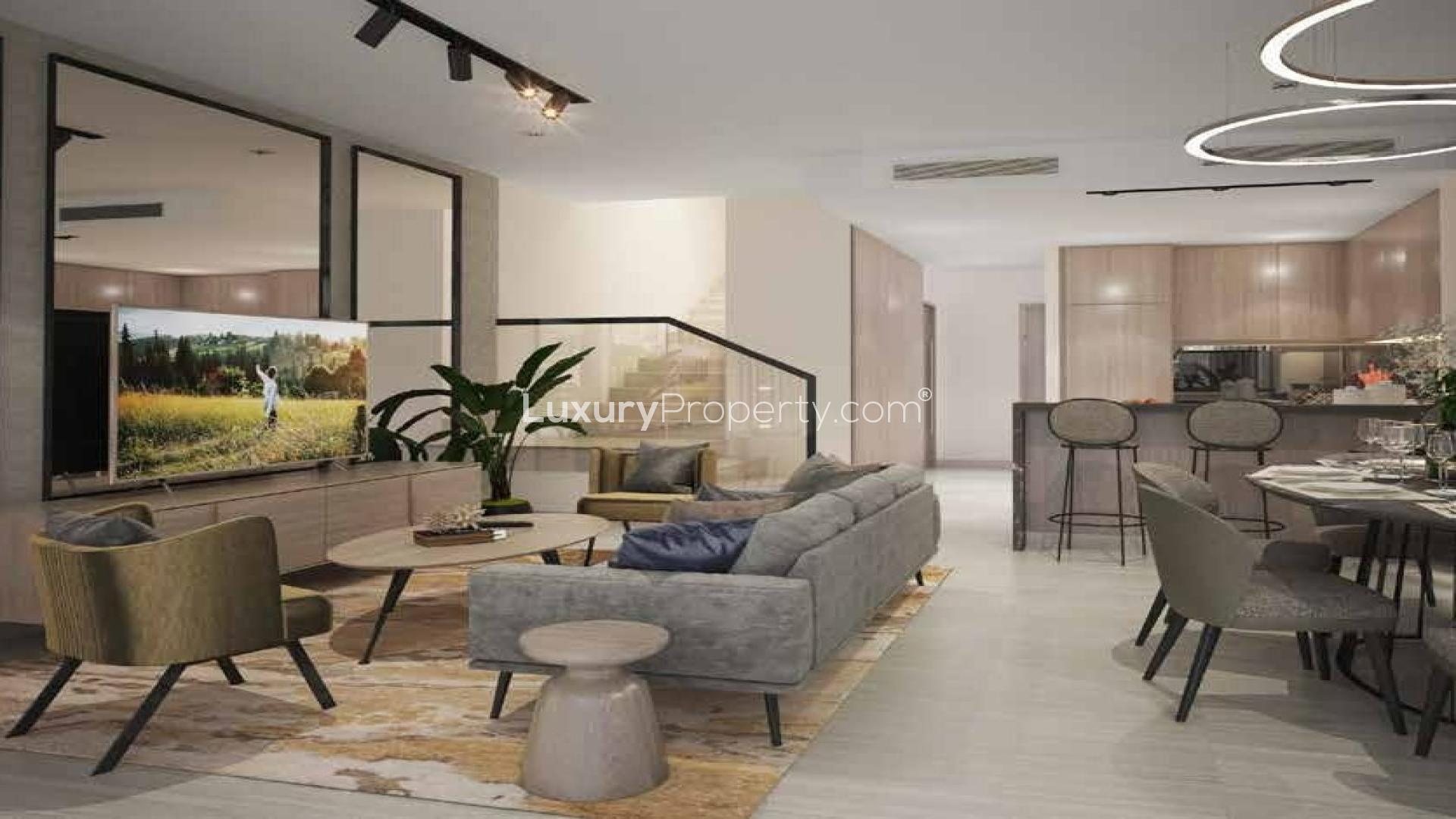 Luxury 4-bedroom villa exterior in Silver Springs, Damac Hills, with lush garden and patio