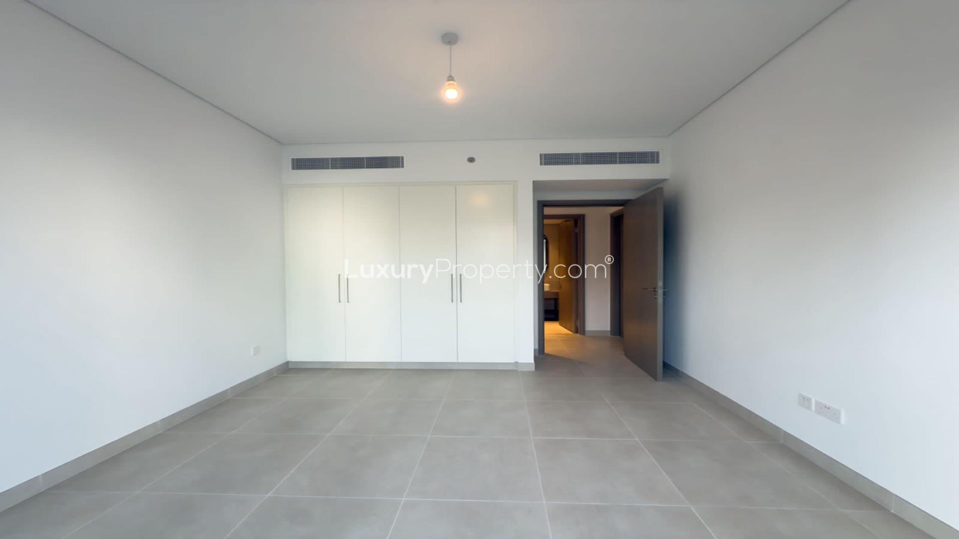 Modern open-plan living area in Creek Beach apartment, Dubai Creek Harbour, for rent
