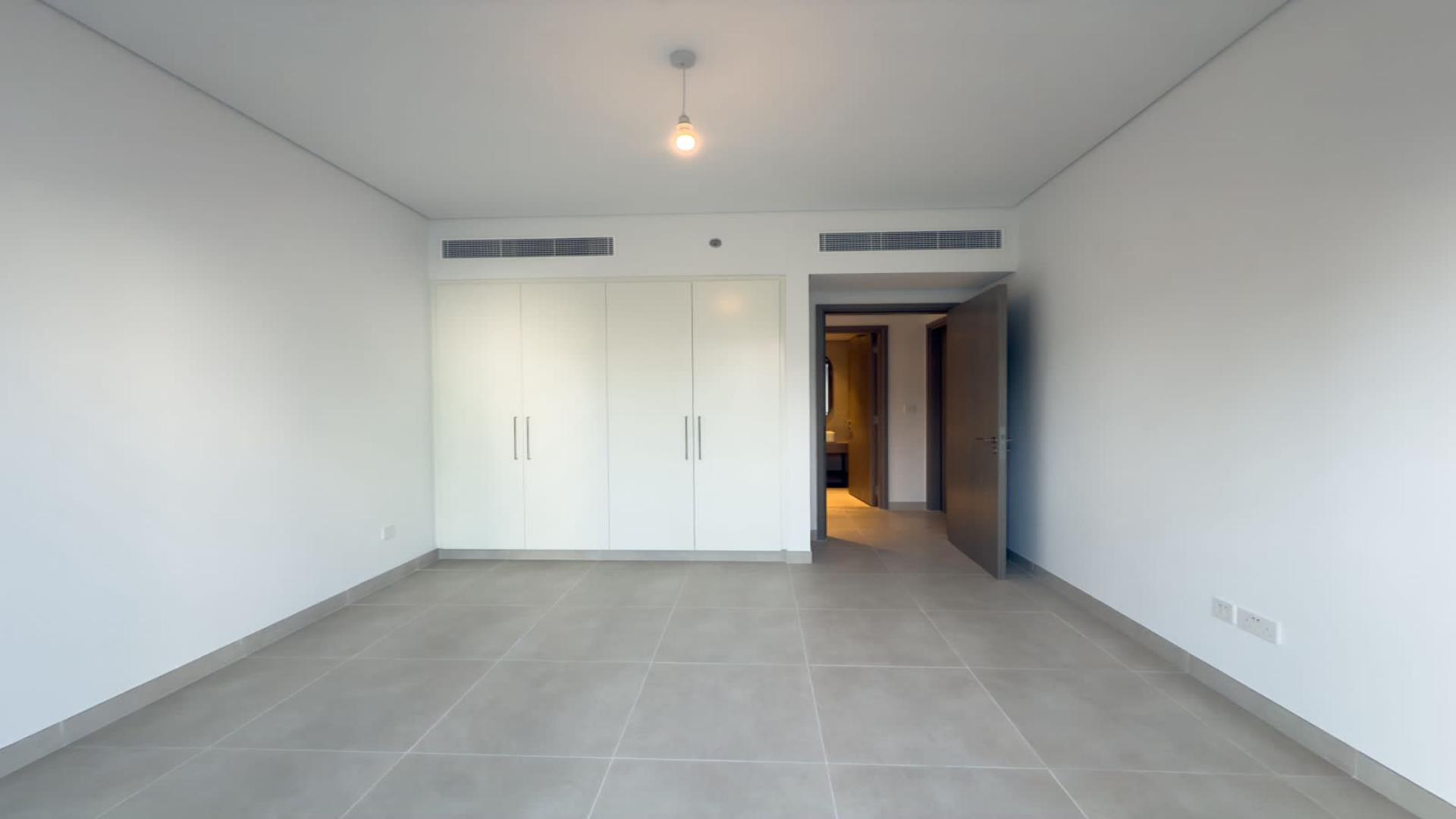 Modern open-plan living area in Creek Beach apartment, Dubai Creek Harbour, for rent