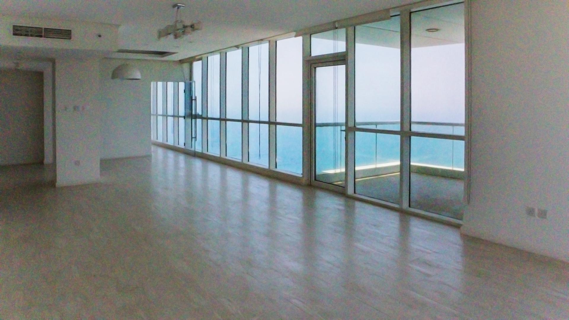 "Panoramic sea views from Al Bateen Residences apartment, Jumeirah Beach Residence, available for rent.",Luxurious Jumeirah Beach apartment with spacious living area and panoramic sea views