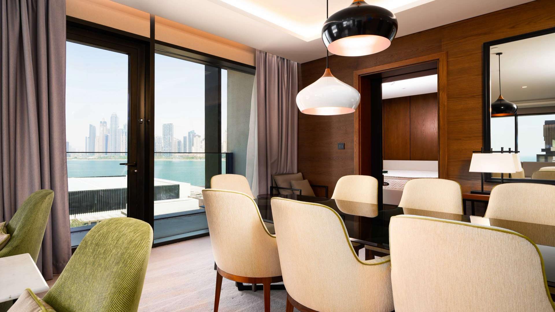 Modern kitchen in 4-bedroom apartment, Caesars Bluewaters Dubai, with sea view and sleek design