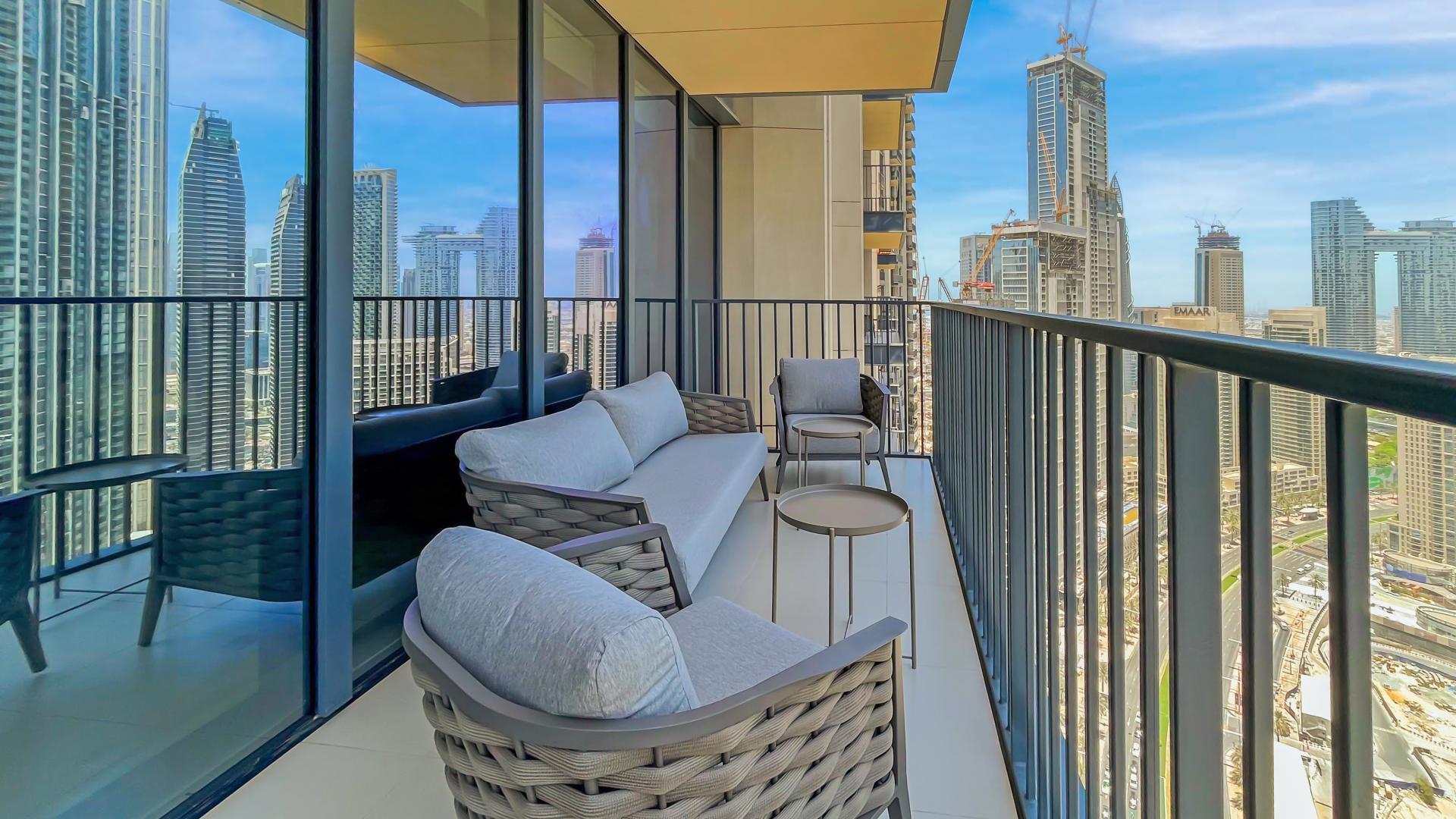 Spacious dining and living area in Downtown Dubai apartment with city views