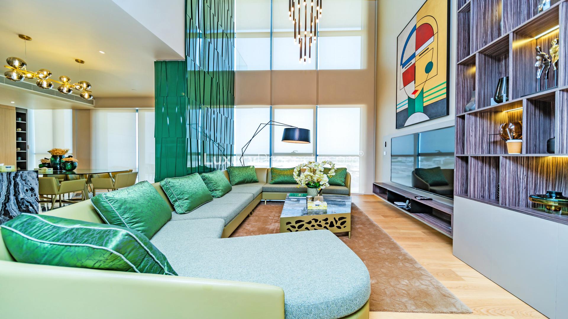 Luxurious living room in City Walk apartment, featuring modern decor and ample natural light