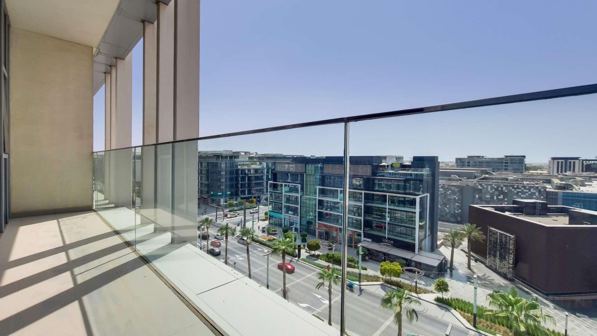 Spacious living area in City Walk penthouse with floor-to-ceiling windows and hardwood floors
