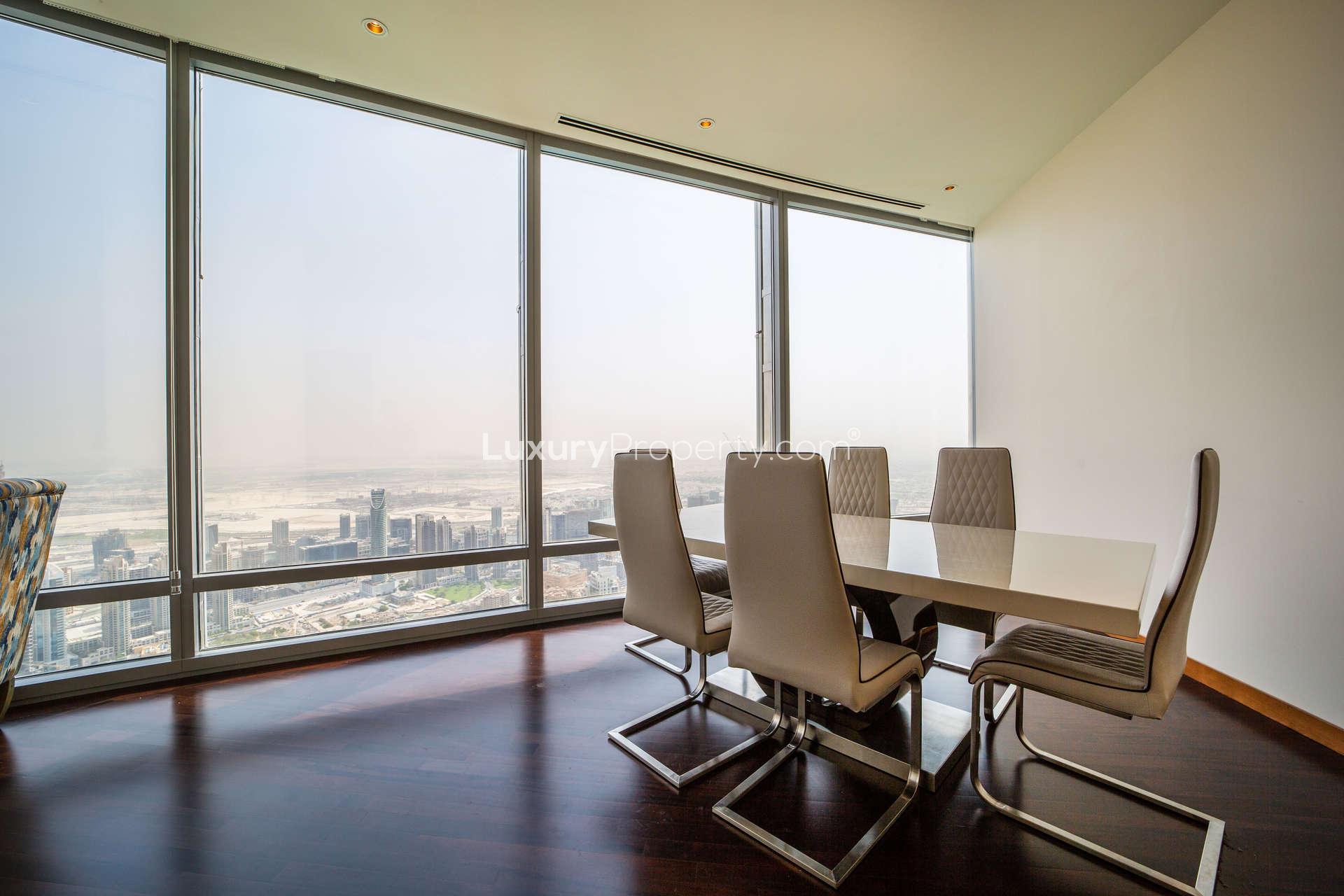 Luxurious kitchen in high-floor Burj Khalifa apartment, featuring modern cabinets and granite countertops