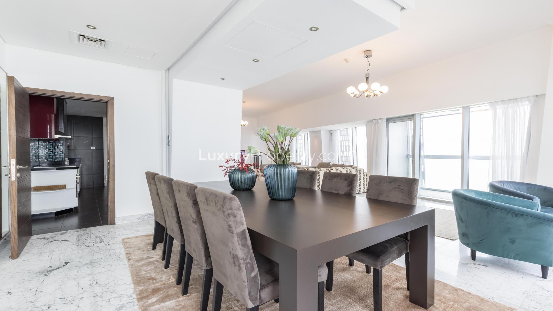 Luxury dining area in fully furnished Dubai Marina penthouse, Cayan Tower, with sea views
