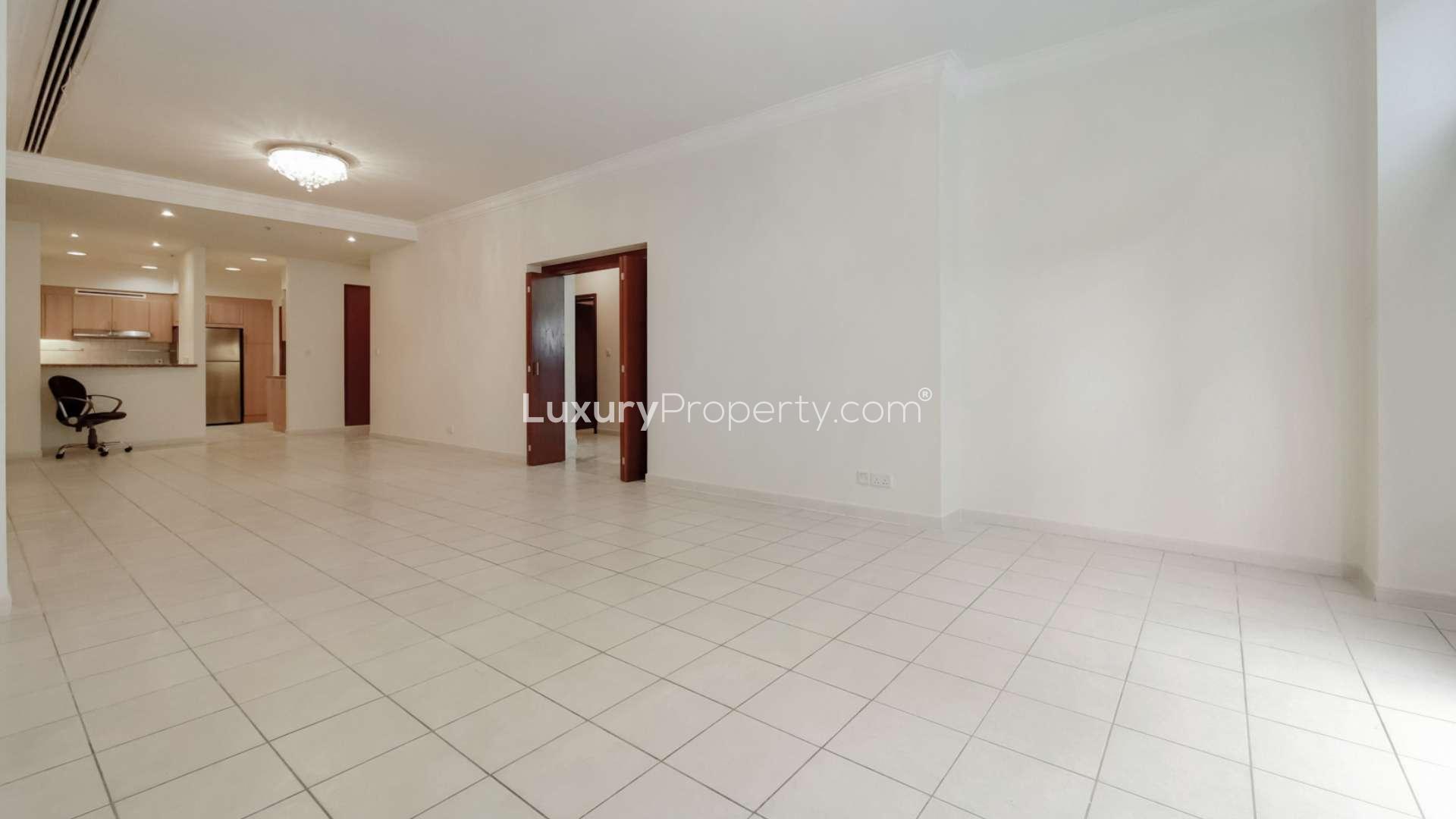 Spacious living area with large windows in Dubai Marina apartment, Emaar 6 Towers