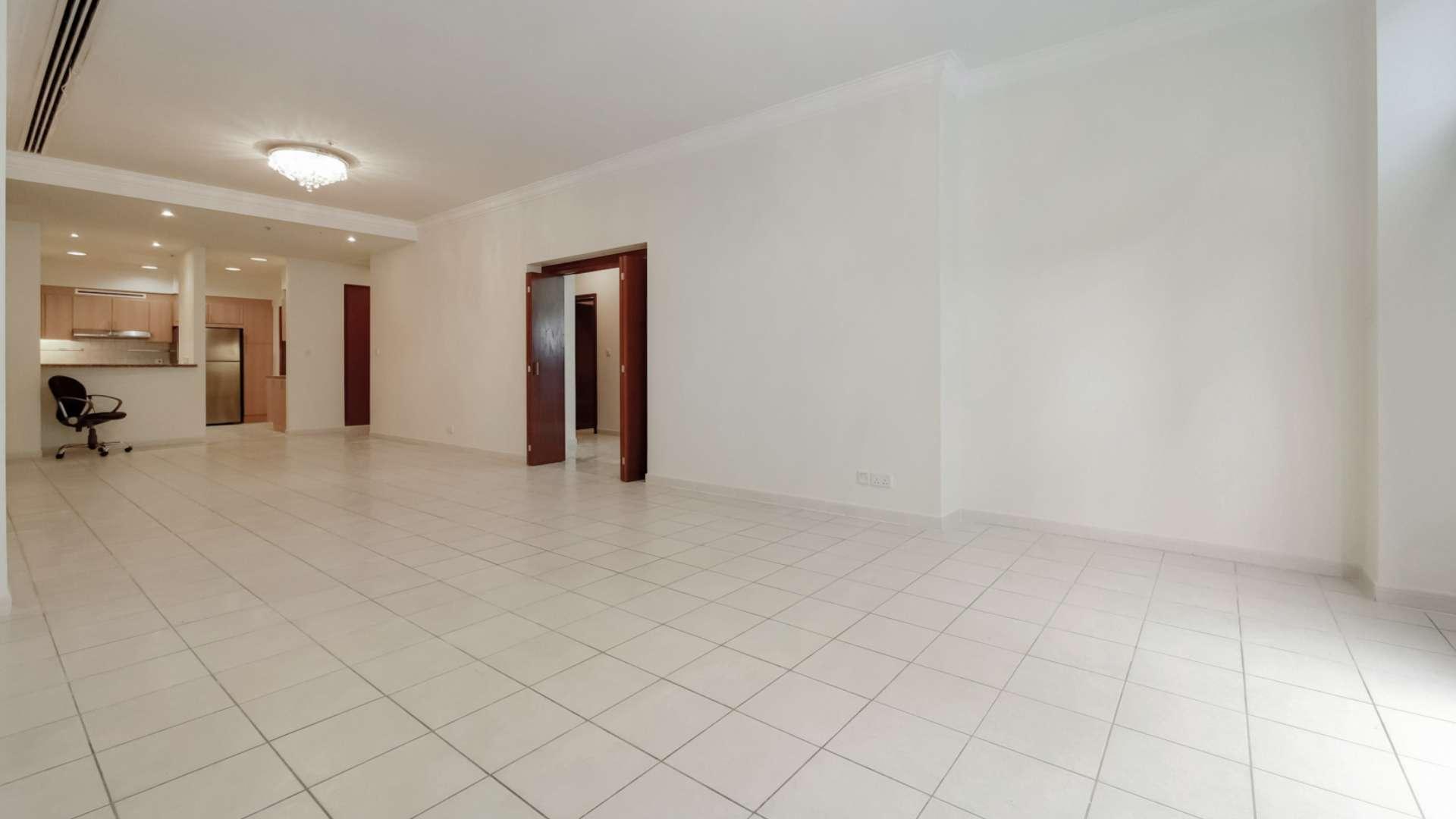 Spacious living area with large windows in Dubai Marina apartment, Emaar 6 Towers