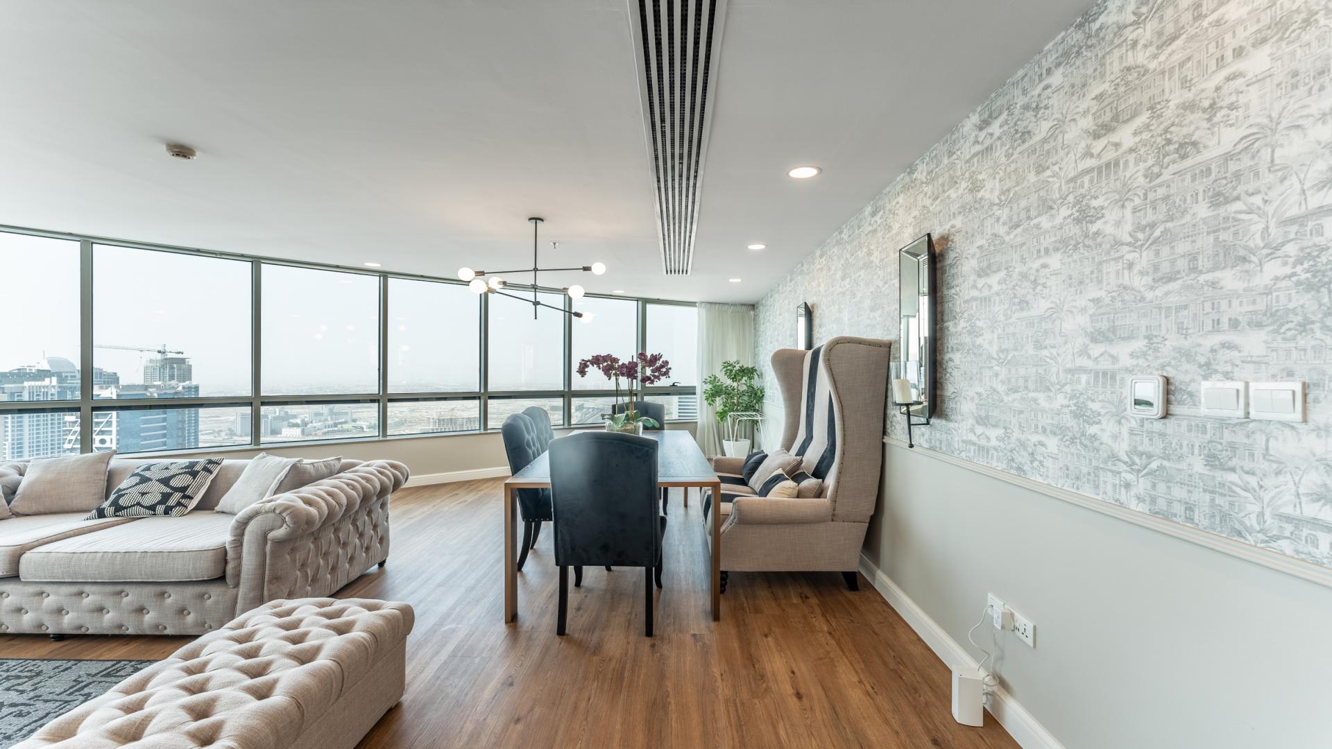 Luxurious living room in 4-bedroom Horizon Tower apartment, Dubai Marina with city views