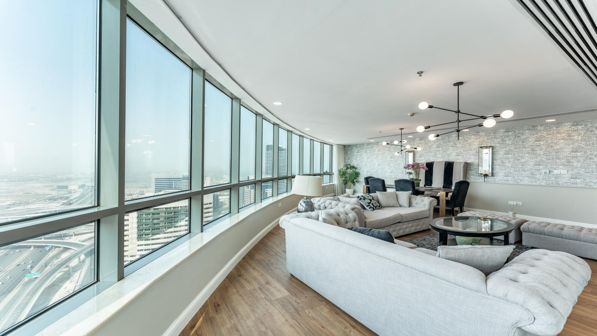 Luxurious living room in Horizon Tower apartment with panoramic Dubai Marina views