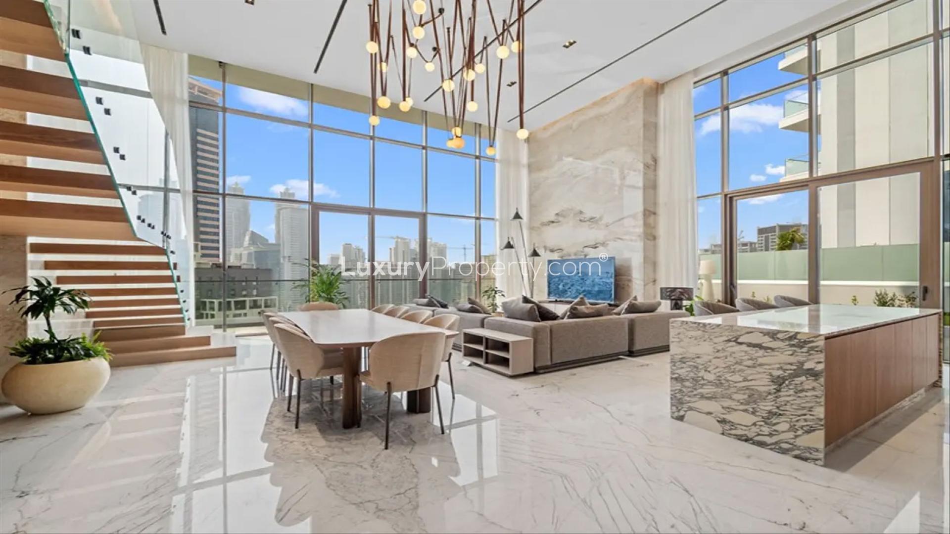 Luxurious living room in Business Bay duplex with city views, modern design, and ample seating