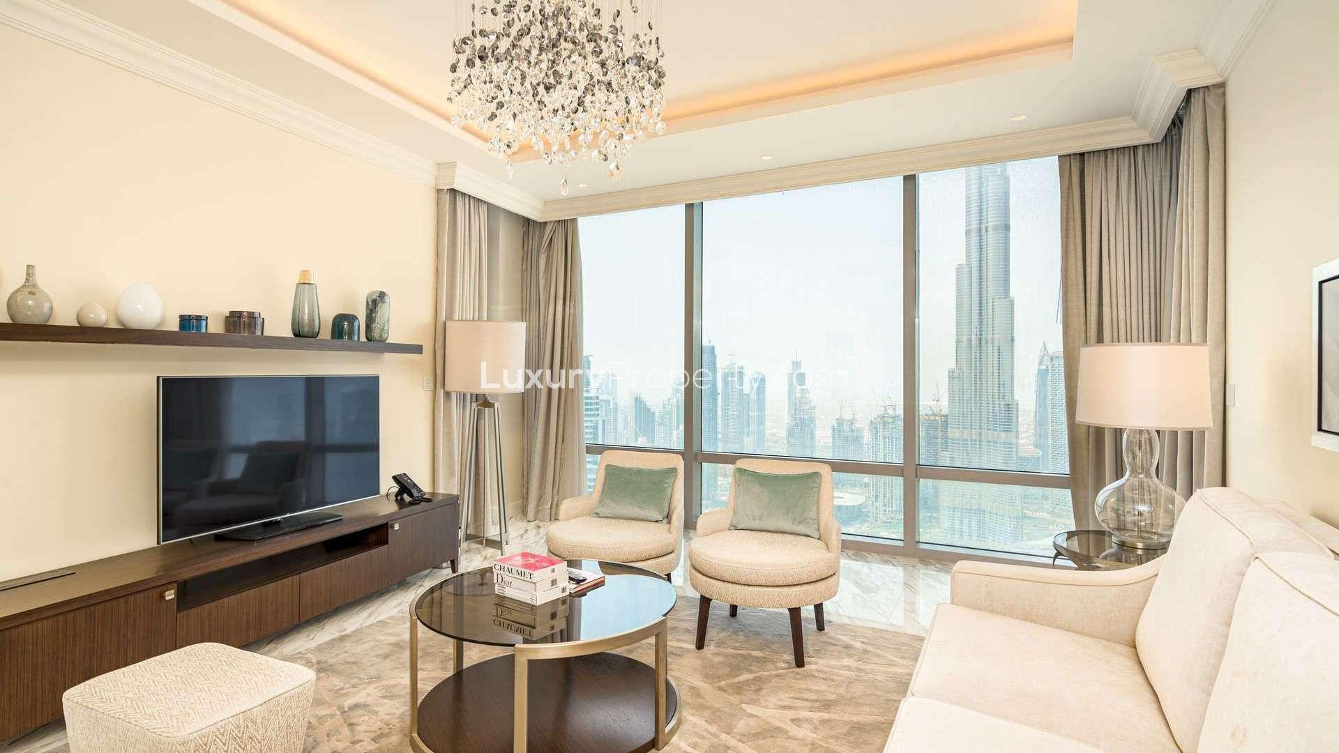 Aerial view of Downtown Dubai skyline with Burj Khalifa and fountains, near serviced apartment
