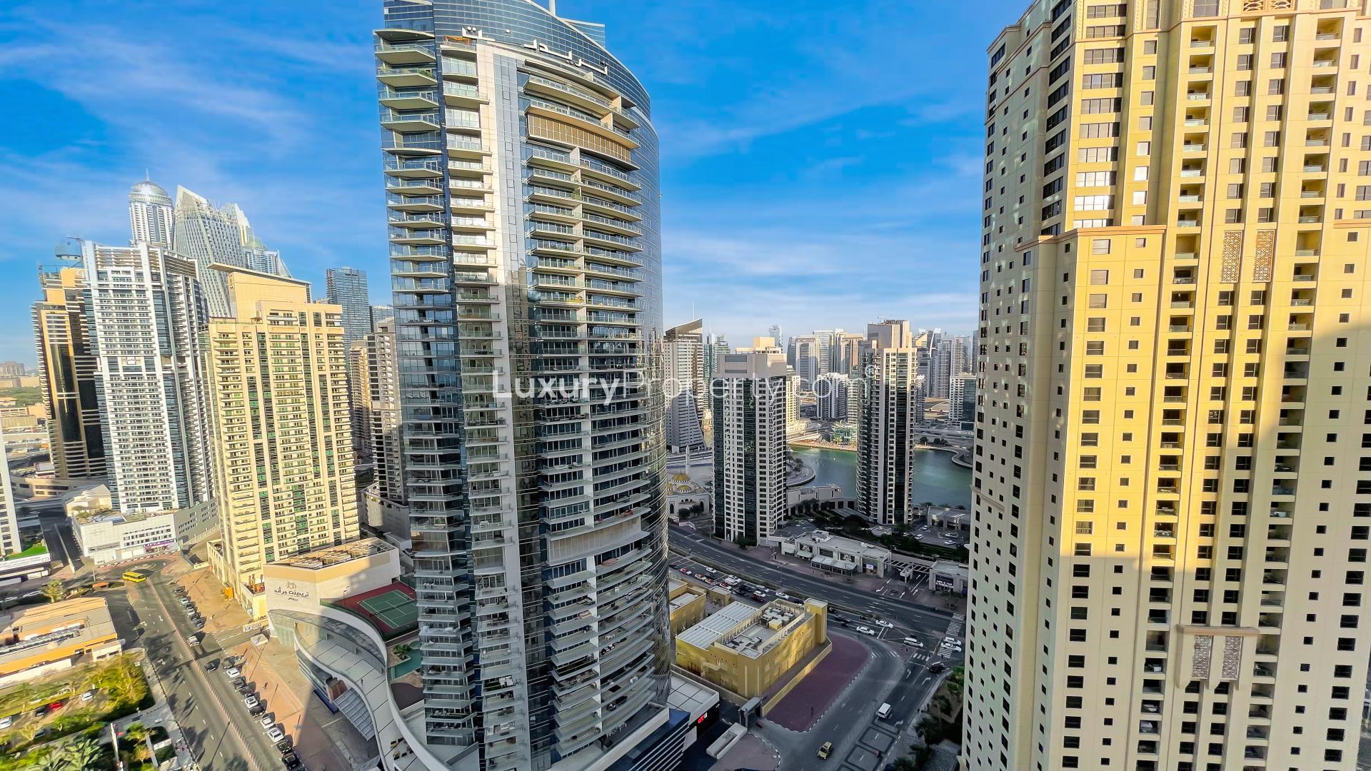 Modern kitchen in Jumeirah Beach Residence apartment, featuring sleek appliances and ample cabinetry