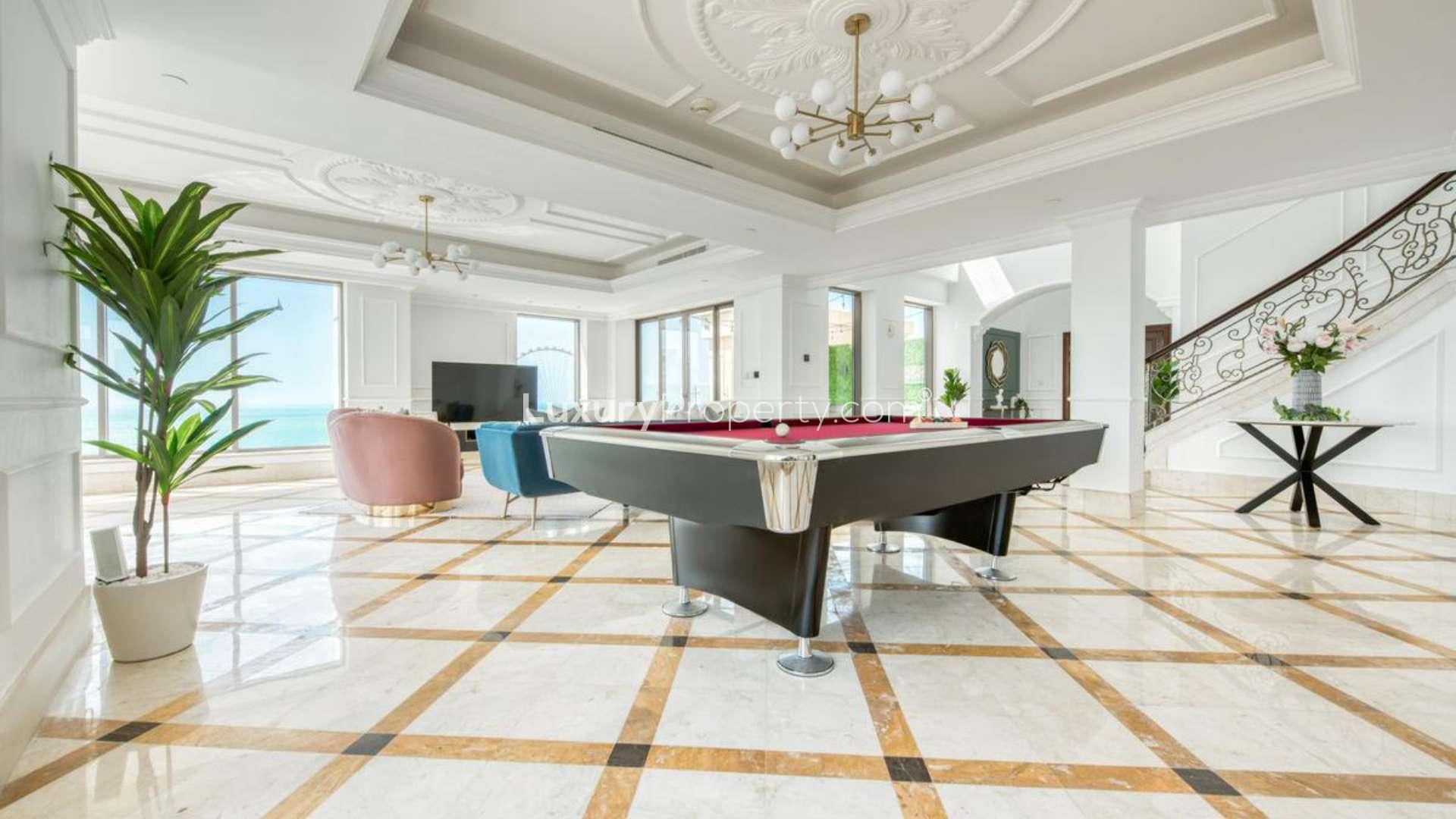 Luxurious furnished living area in Jumeirah Beach Residence penthouse with elegant decor and seating