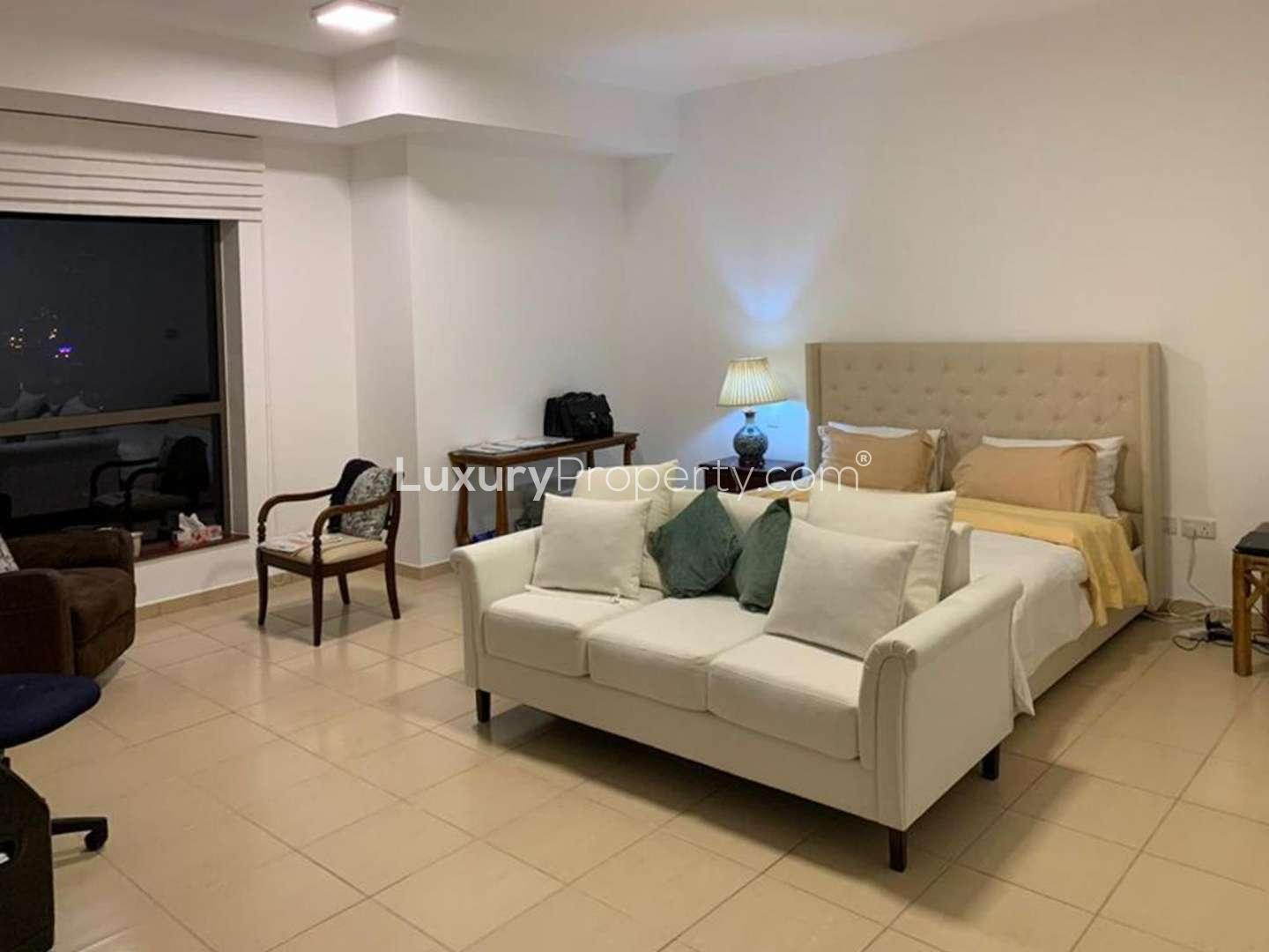 Interior view of 4-bedroom apartment in JBR, featuring elegant decor and open kitchen