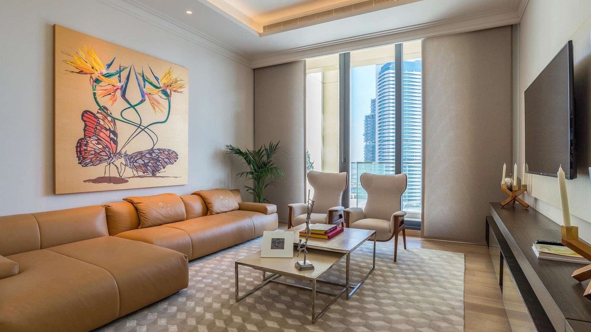 "Entrance of The 118 Downtown penthouse, glass facade, luxury apartment for sale in Dubai.",Modern living room in luxury penthouse at The 118 Downtown, Dubai with city view
