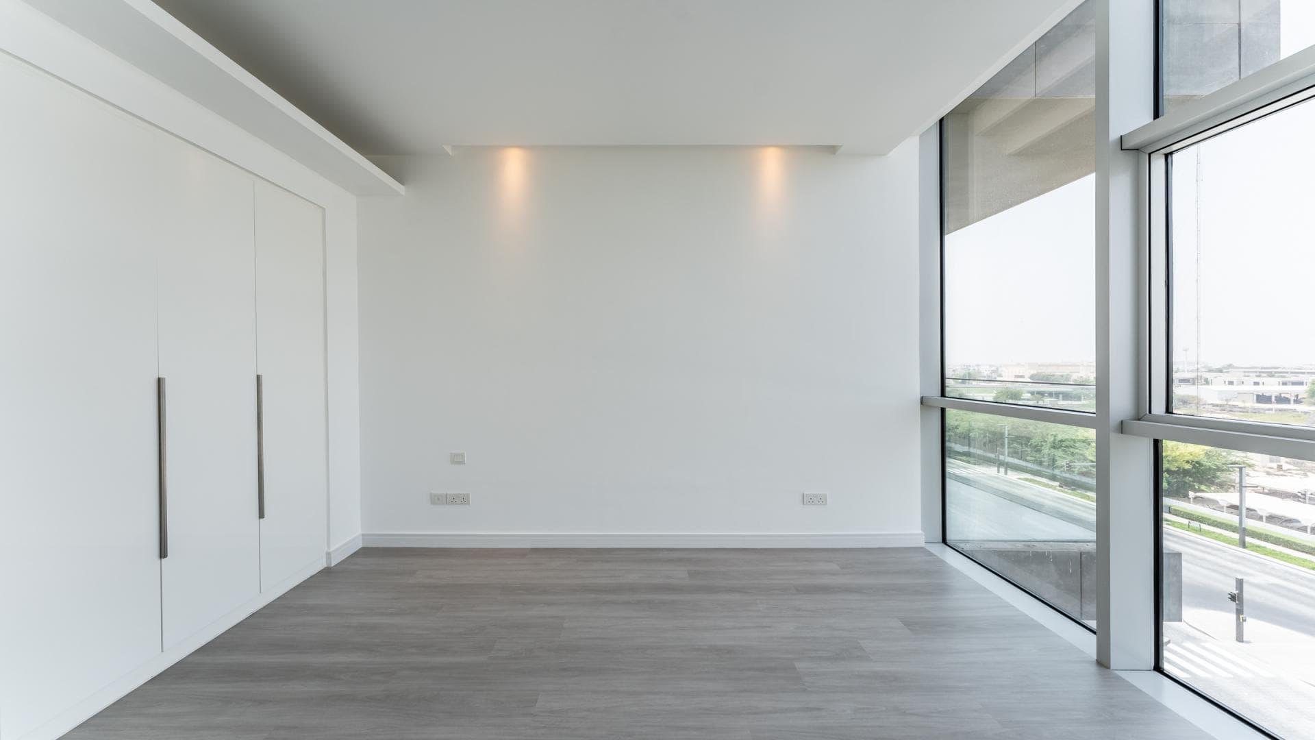 Spacious modern living area with large windows in City Walk apartment for rent