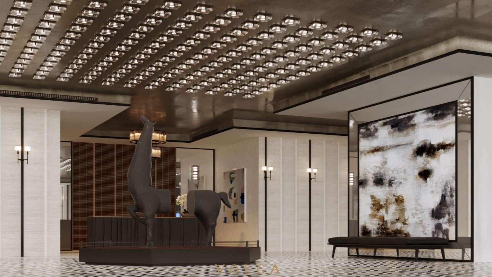 "Volga Tower apartment building in Jumeirah Village Triangle, modern architecture, for sale.",Luxurious lobby in Volga Tower, Jumeirah Village Triangle apartment for sale, elegant design