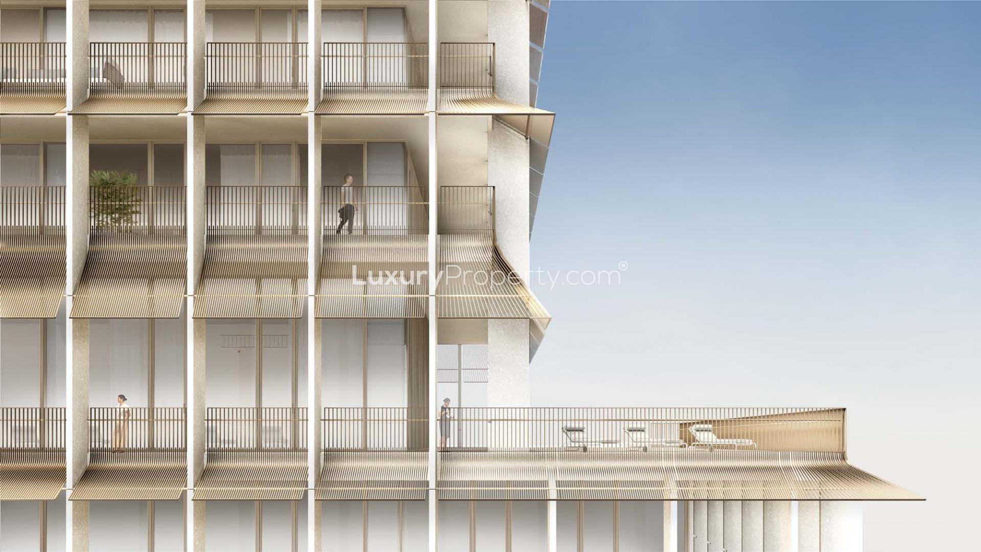 "Elegant balconies at Four Seasons Residences DIFC apartment, Dubai, for sale, LP41196.","Modern balconies at Four Seasons Private Residence, DIFC apartment for sale, luxury living.",Exterior view of Four Seasons Private Residence DIFC with outdoor seating and trees