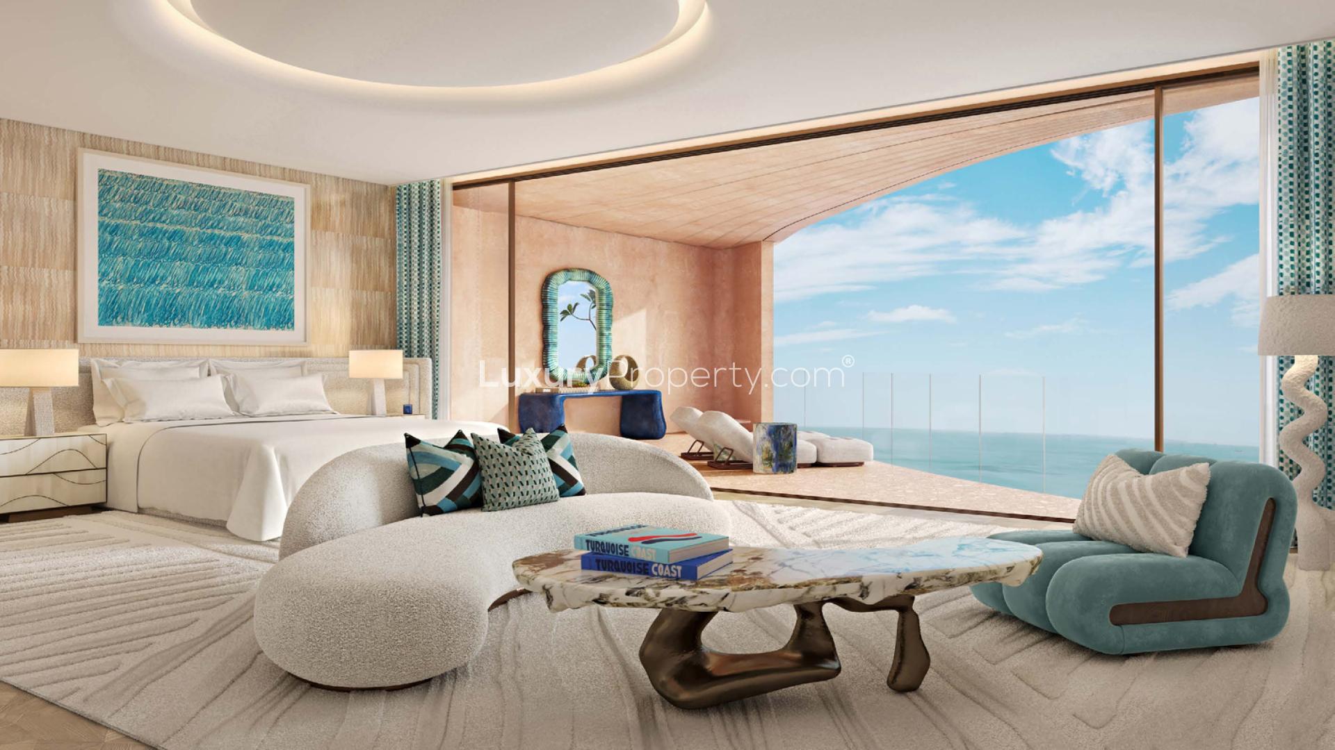 Luxurious lobby in Jumeirah Asora Bay 4-bedroom apartment with elegant chandelier and artwork