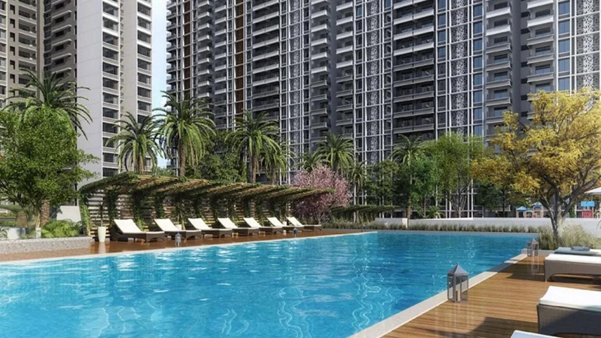 Luxurious Marina One apartments in Kochi with poolside view and elegant lounge area