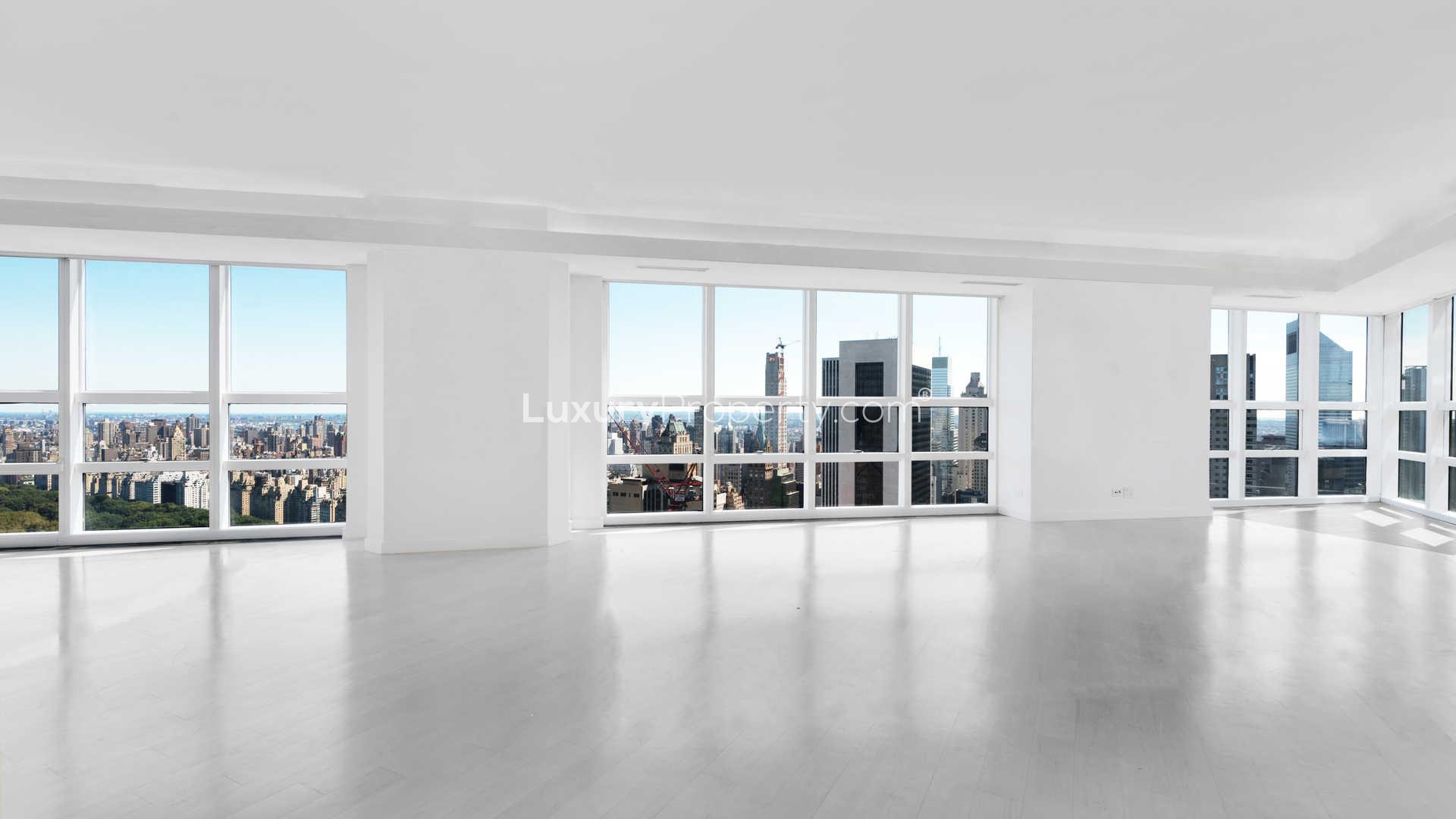 Spacious luxury apartment interior with large windows and stunning Manhattan skyline views