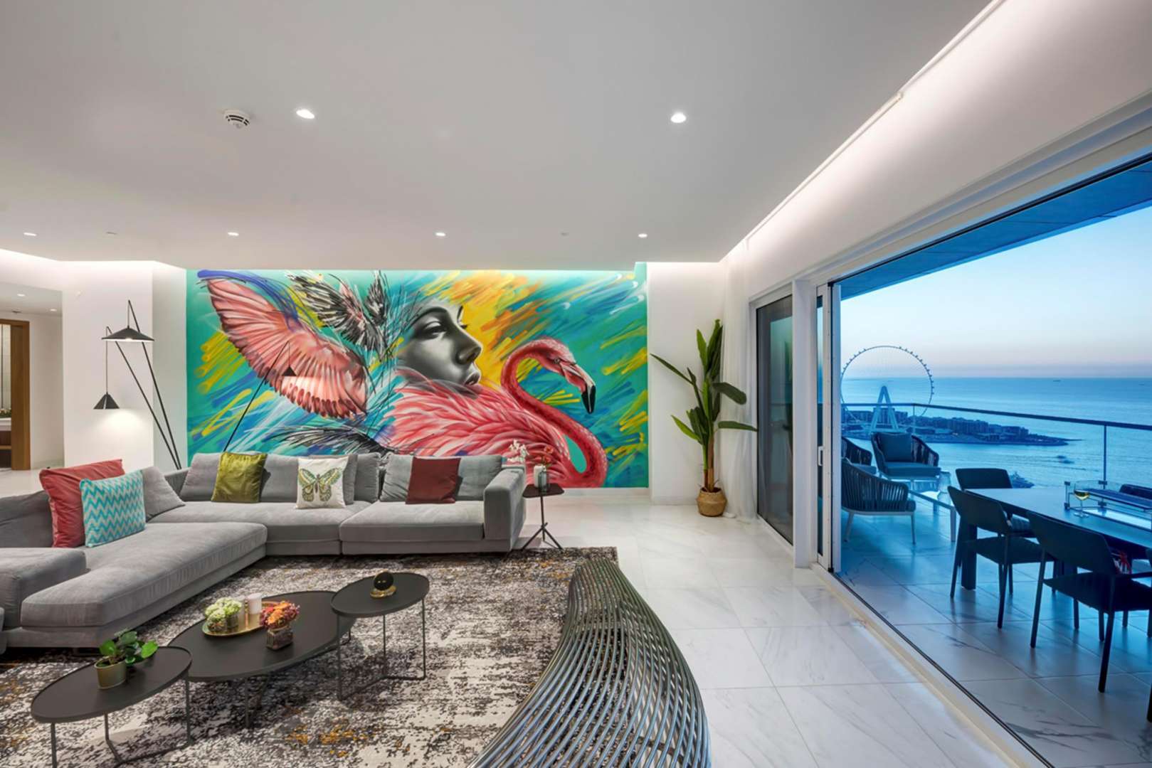 Open-plan living and dining area in 4-bedroom JBR apartment with sea view balcony