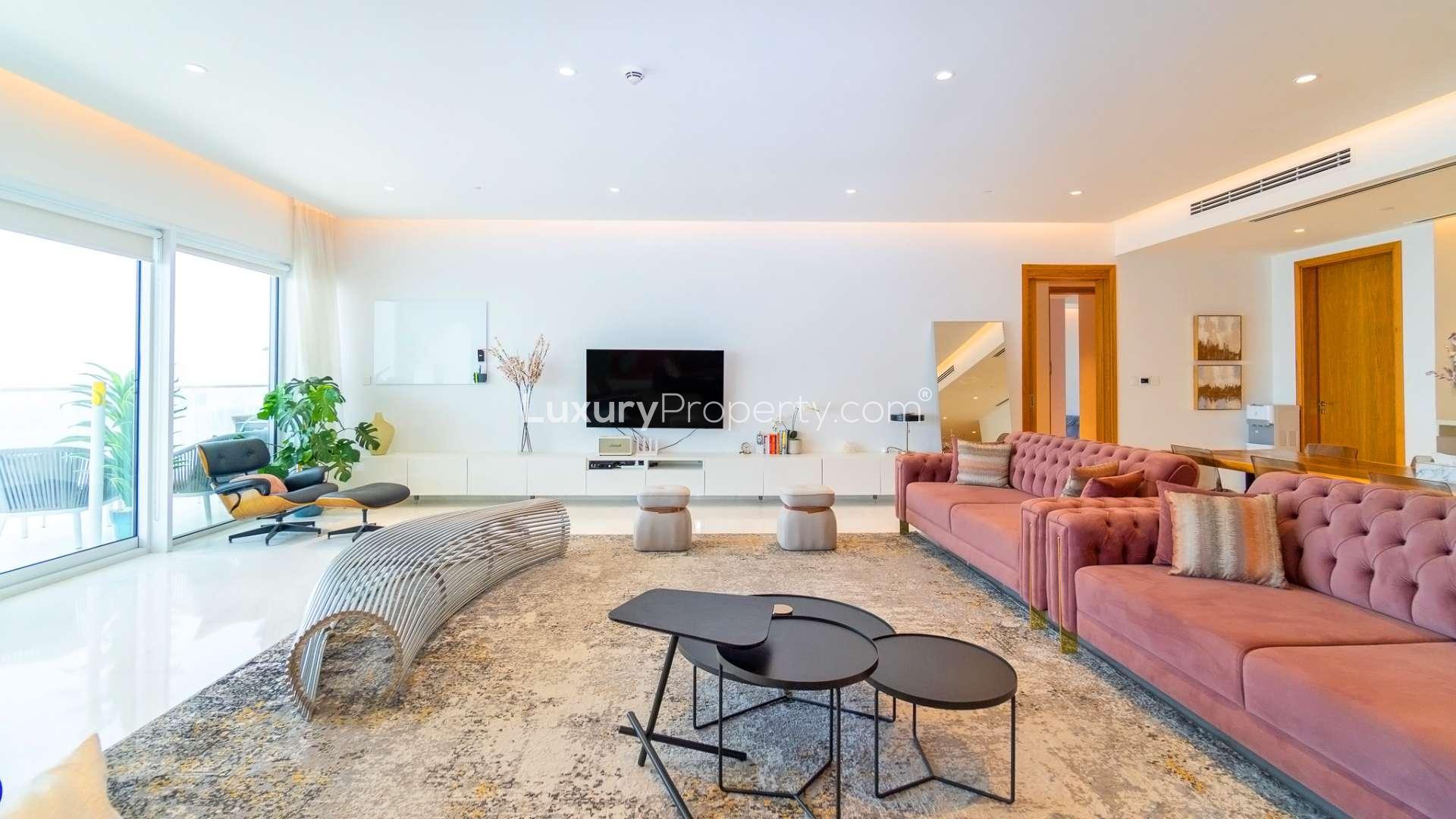 Luxury balcony with sea views, modern seating, and glass railing at 1 JBR apartment