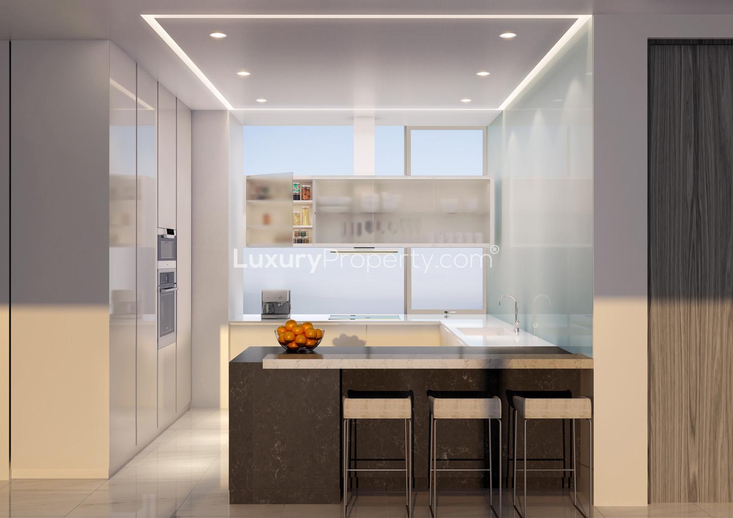 Luxurious dining and kitchen area with ocean view in 1 JBR, Dubai apartment