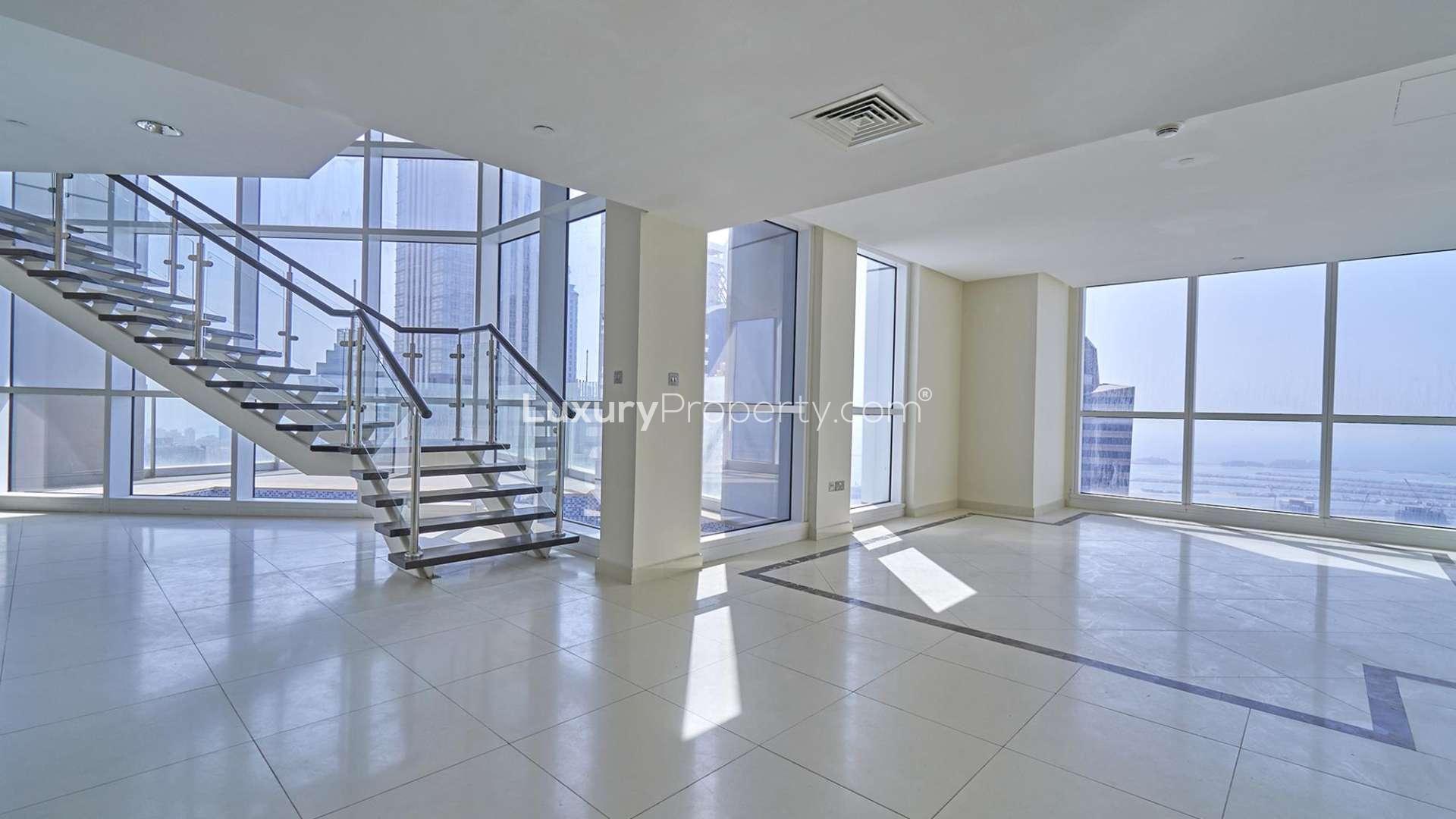 Spacious living area in high-floor duplex penthouse with stunning Dubai Marina sea view