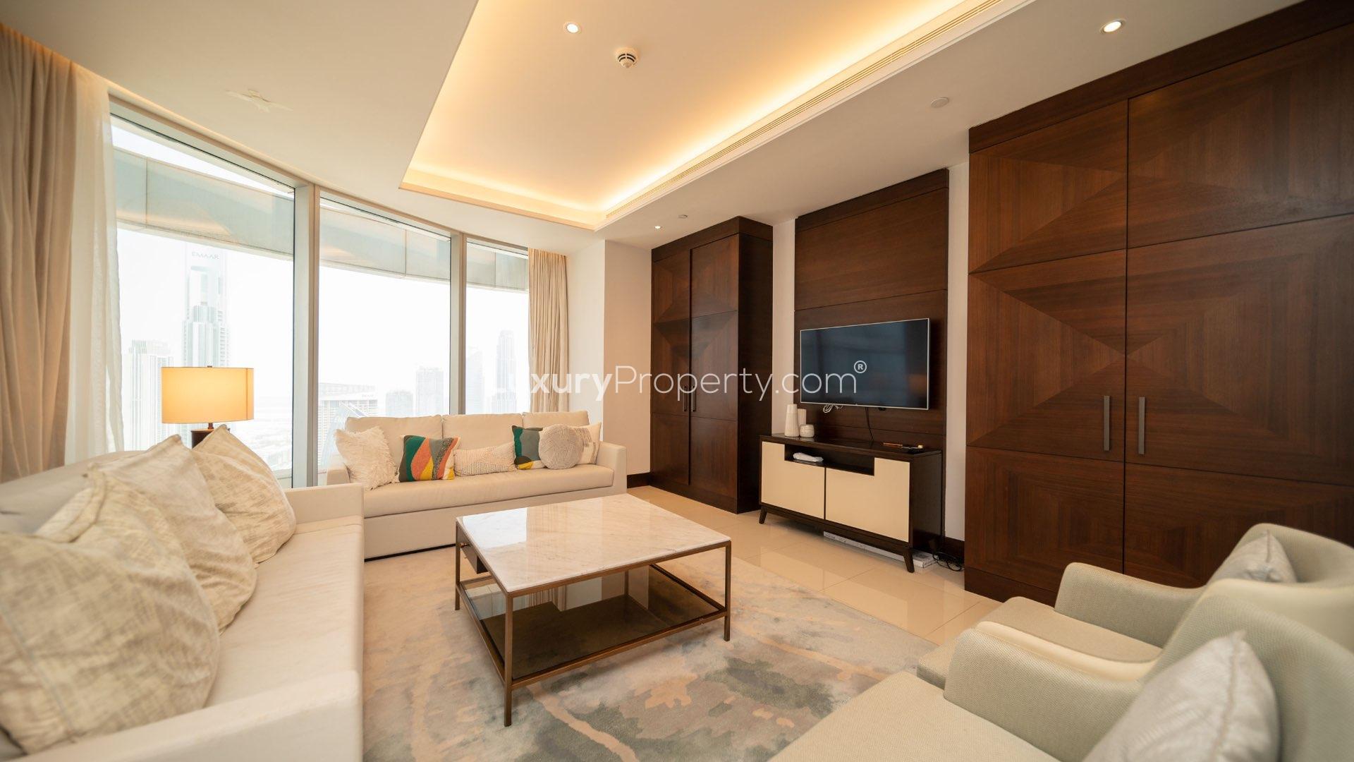 Luxurious furnished apartment living and dining area with Burj Khalifa views, Downtown Dubai