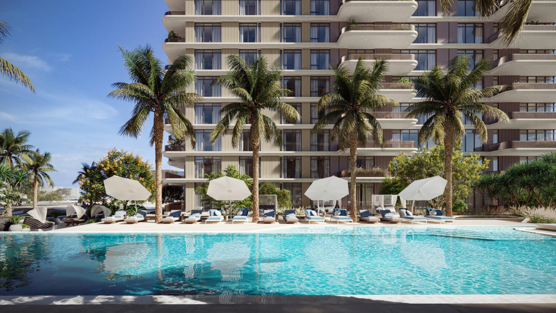 Luxurious Dubai Islands waterfront apartment with lush garden and modern gym facilities