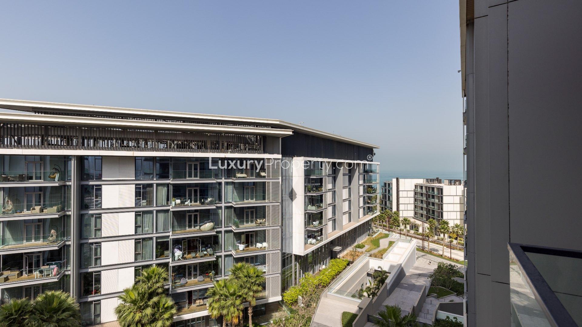 Spacious living area in Bluewaters Residences apartment with modern decor and partial sea view