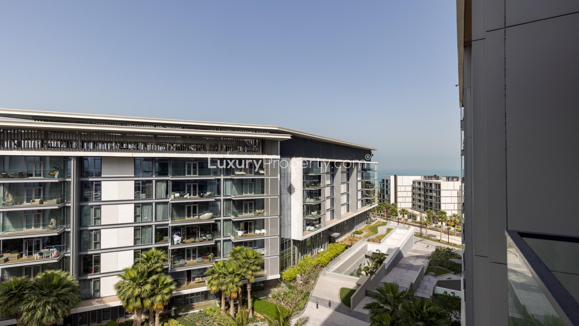 Luxurious bathroom with modern shower and bathtub in Bluewaters Island apartment for sale