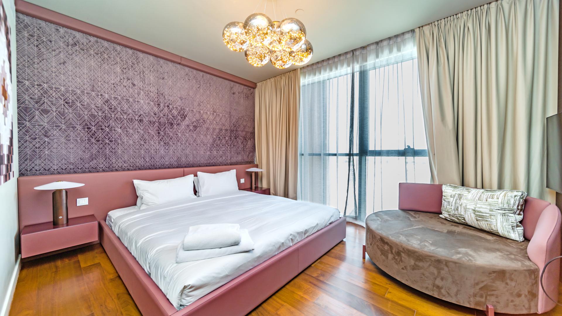 Modern kitchen with marble island in 4-bedroom duplex condo, City Walk, Building 13B