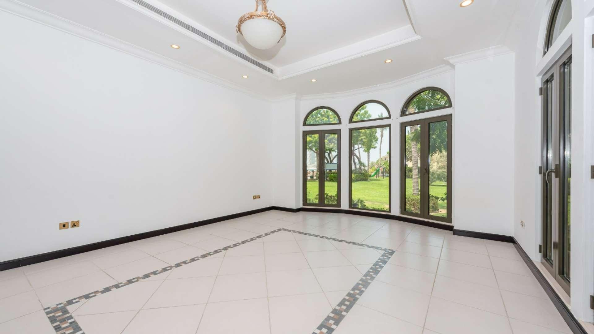 Spacious living area with garden views in Palm Jumeirah apartment for sale