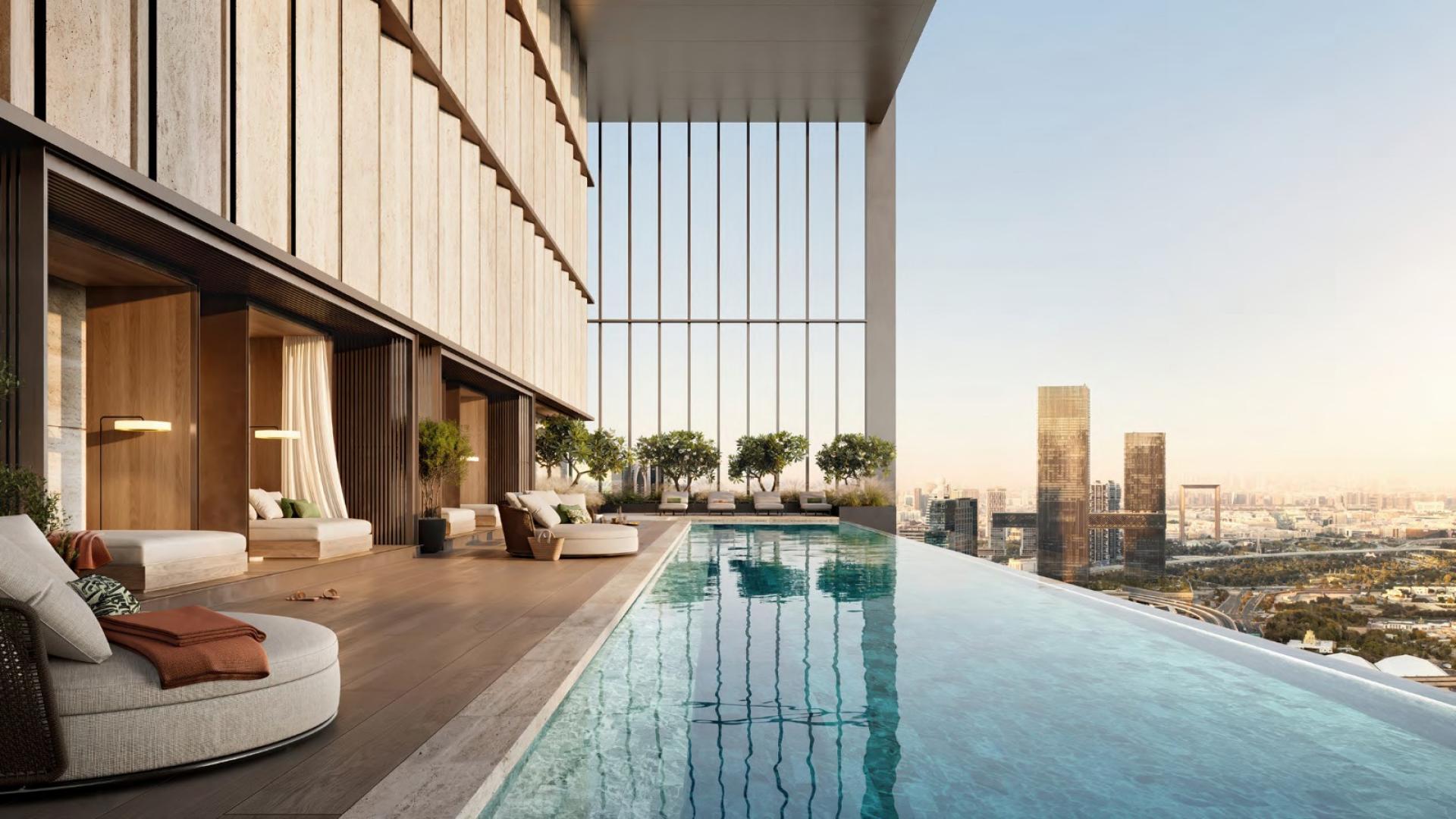 Luxurious apartment terrace with infinity pool and stunning Dubai skyline view at sunset