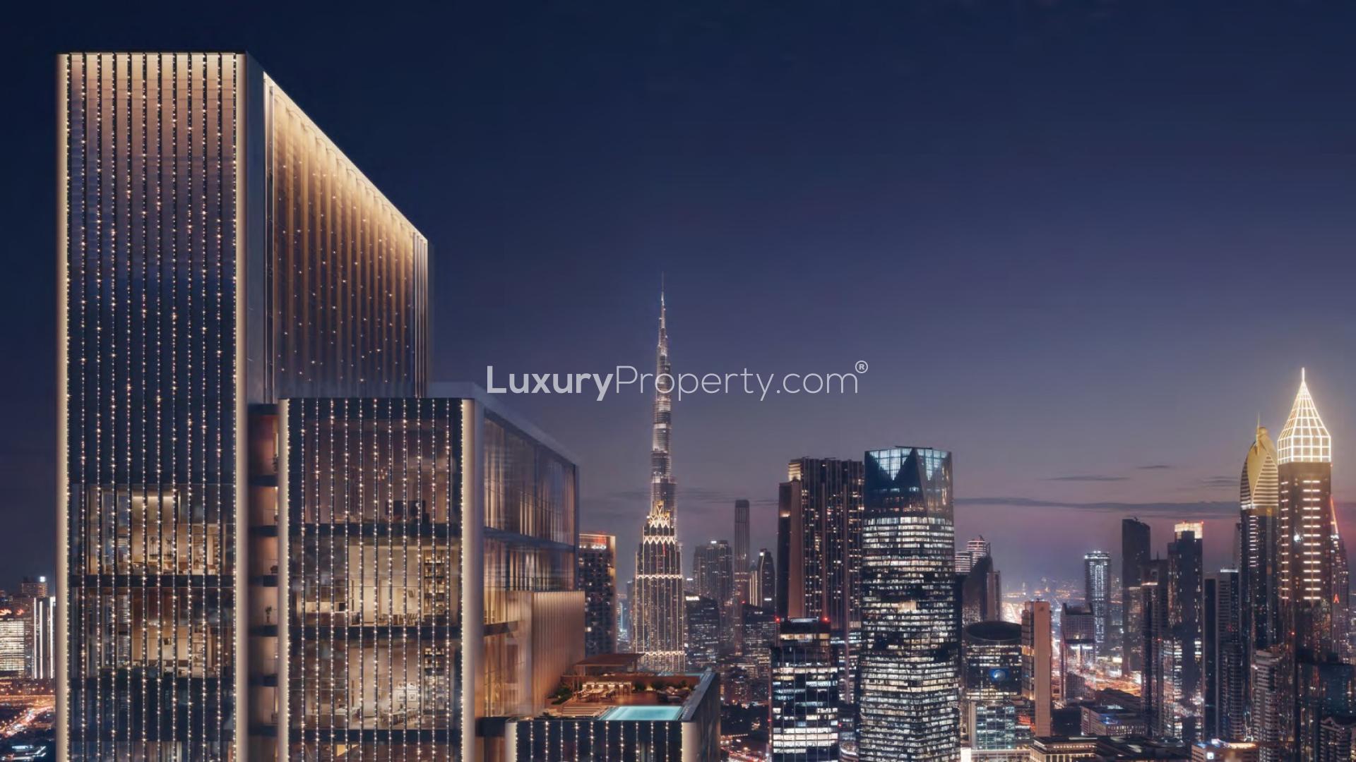 "Stunning night view of Emirates Towers, Sheikh Zayed Road, near Jumeirah Residences apartment.",Aerial view of Emirates Towers near Jumeirah Residences, Sheikh Zayed Road, Dubai skyline