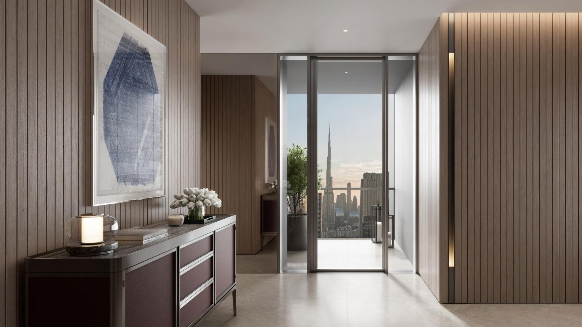 Luxurious apartment terrace with infinity pool overlooking Dubai skyline at sunset, Emirates Towers