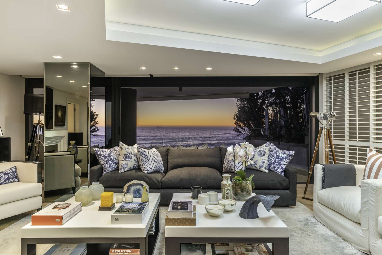 Luxurious living room in 5-bedroom Clifton apartment with ocean view at sunset