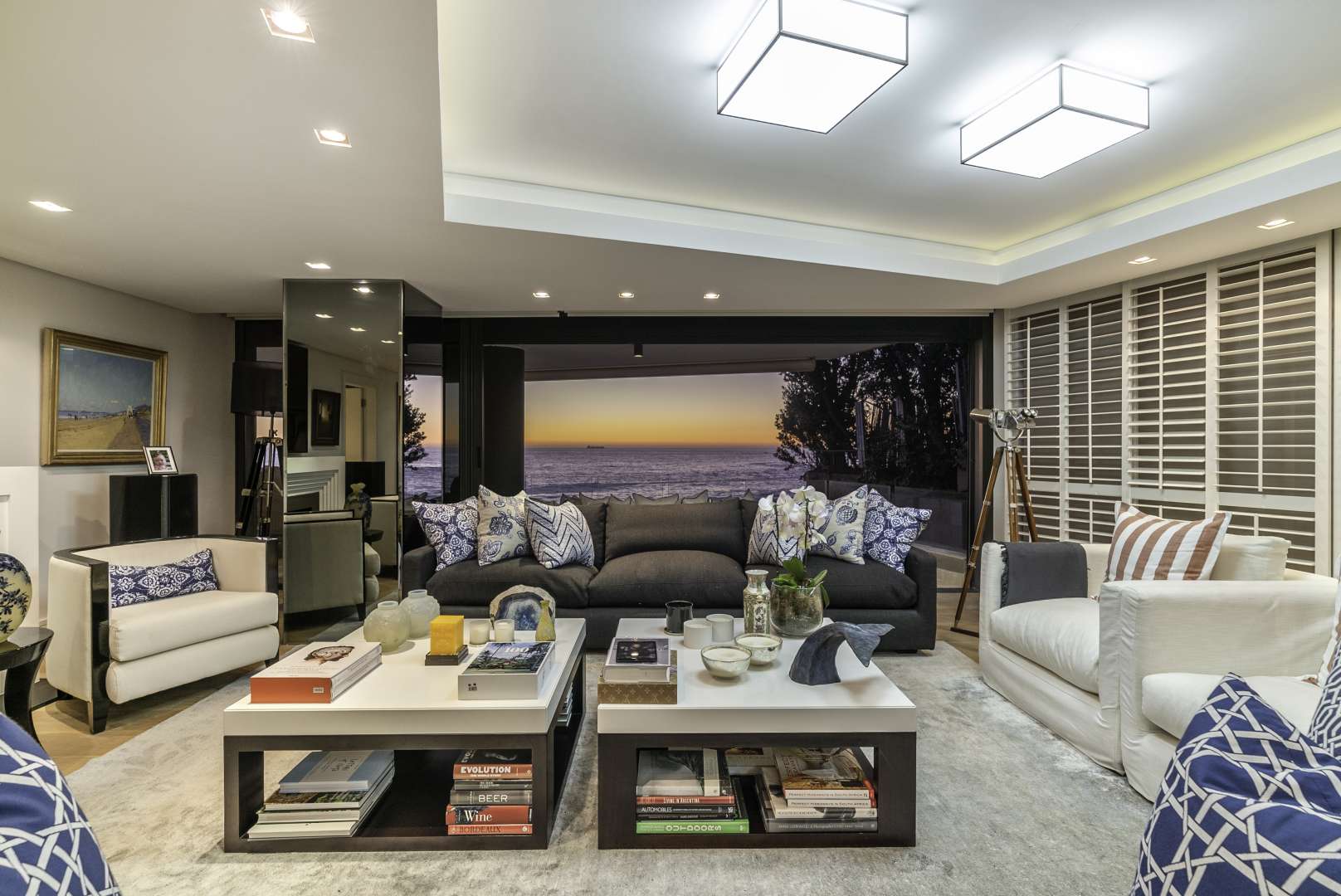 Luxurious Clifton apartment living room with ocean view at sunset, Cape Town