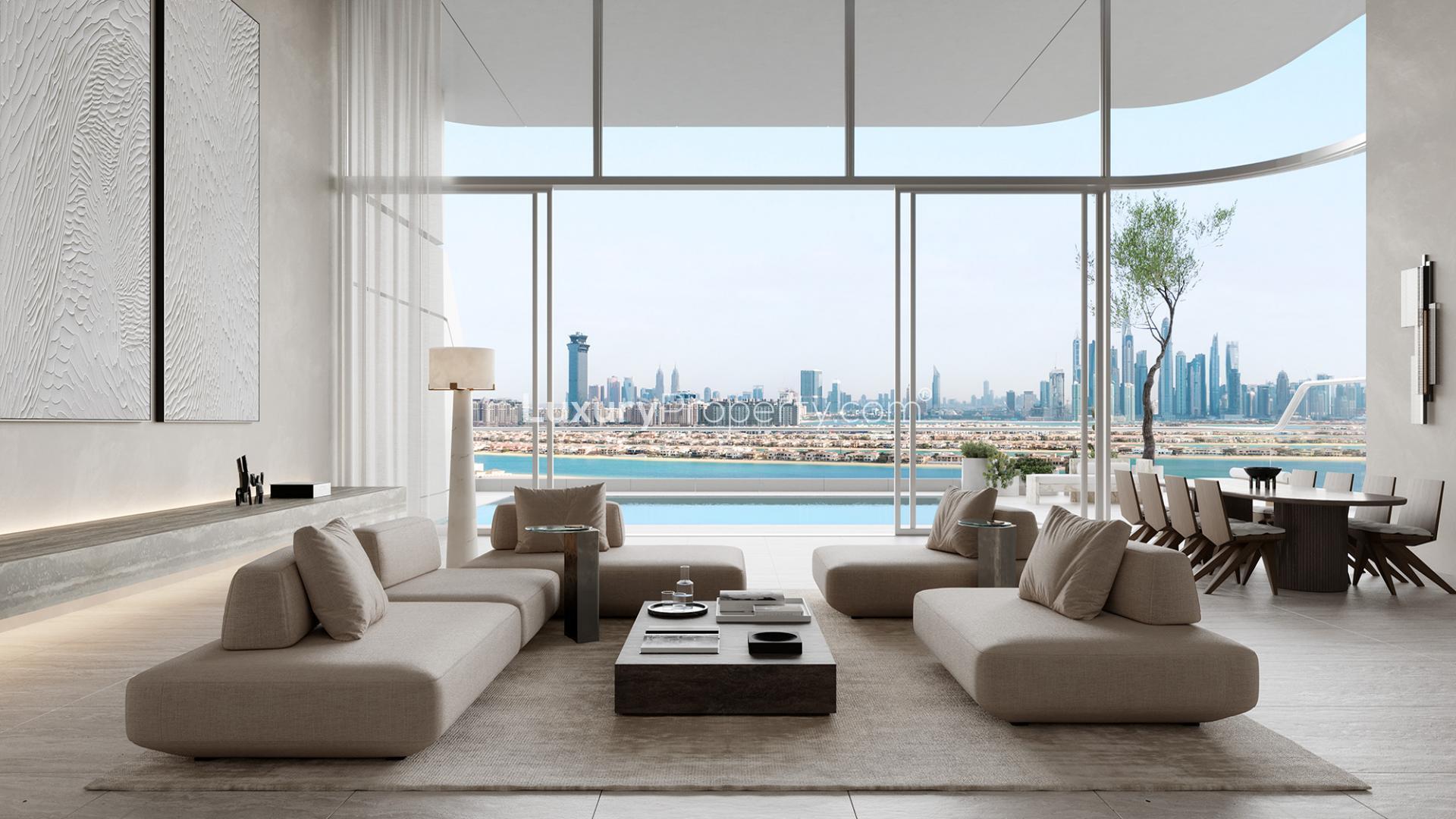 Infinity pool with ocean views at Orla Palm Jumeirah apartment, Dubai skyline in background